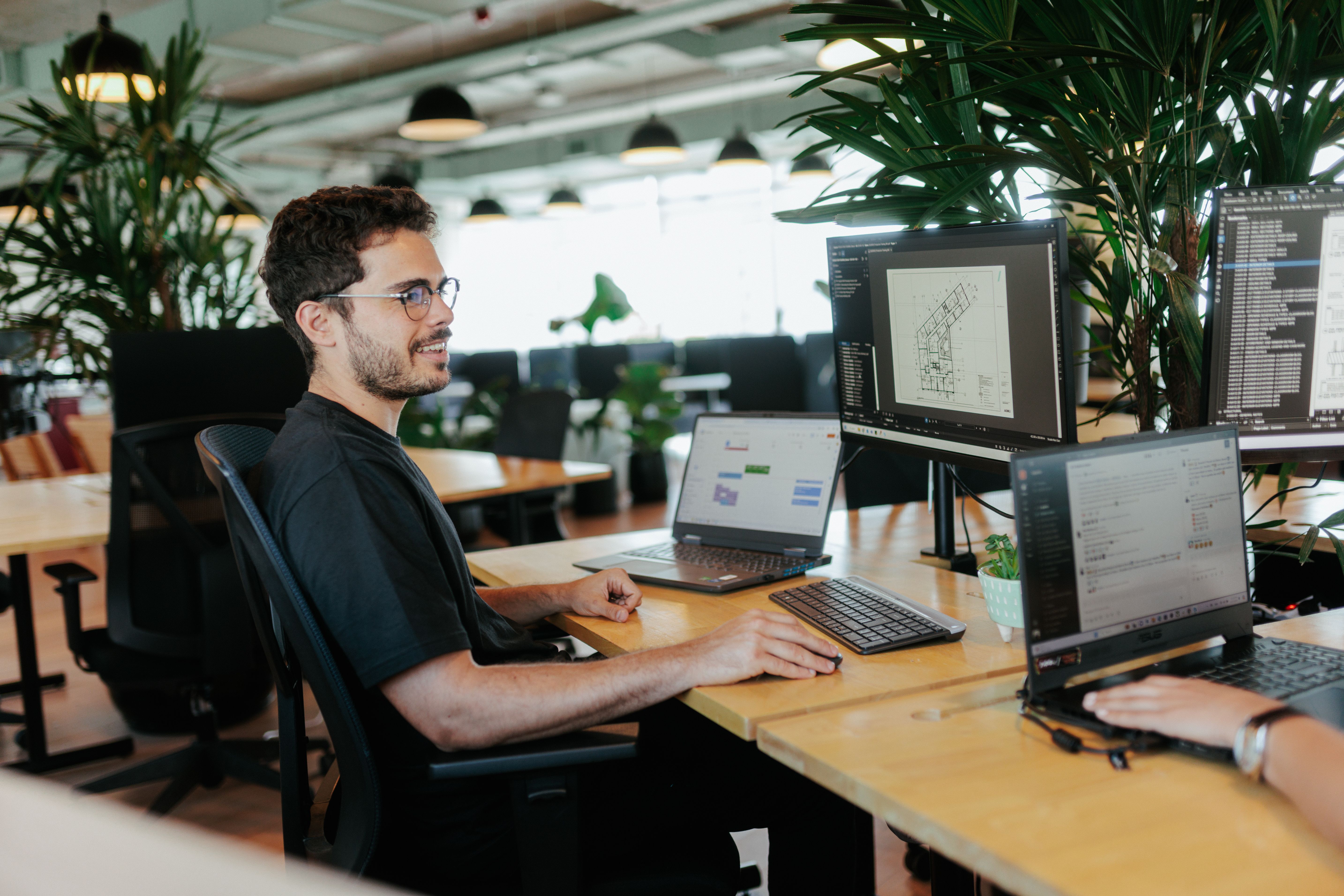 Slanter working at his desk, at the office