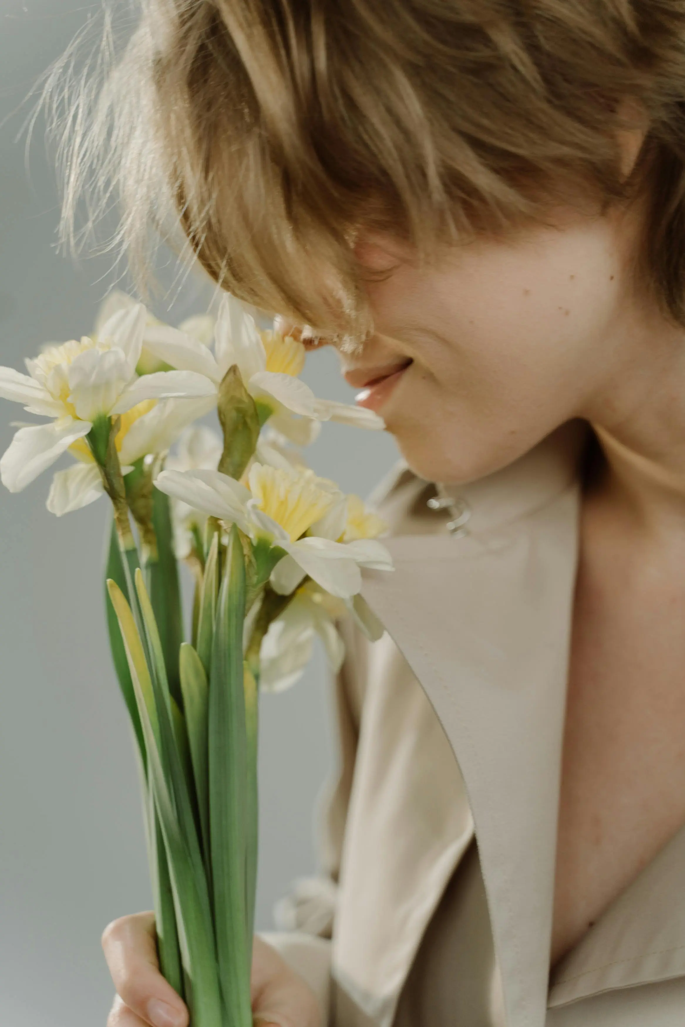 Sophia Reynolds is smelling flowers