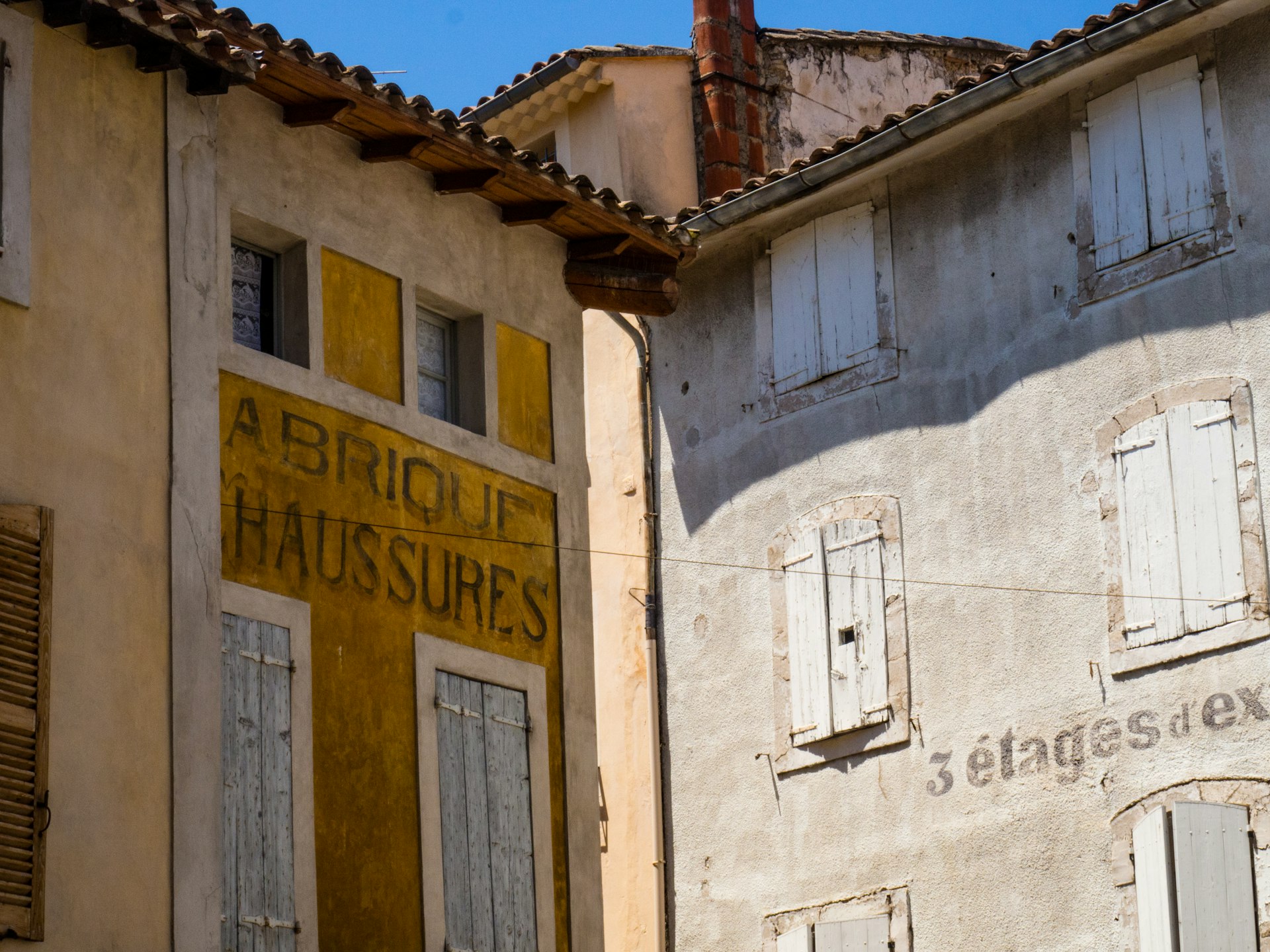 Painted lettering on old building facades