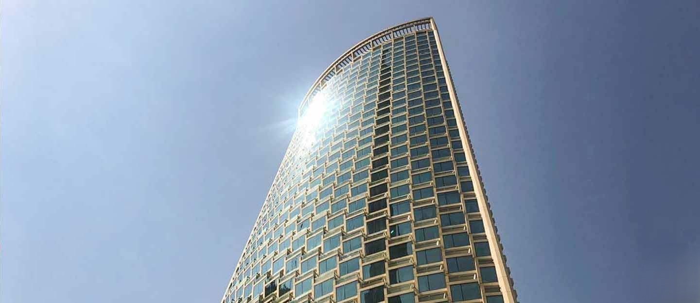 Upward view of Burj Vista Tower 1. Experience luxury living in Dubai with our dedicated real estate services.