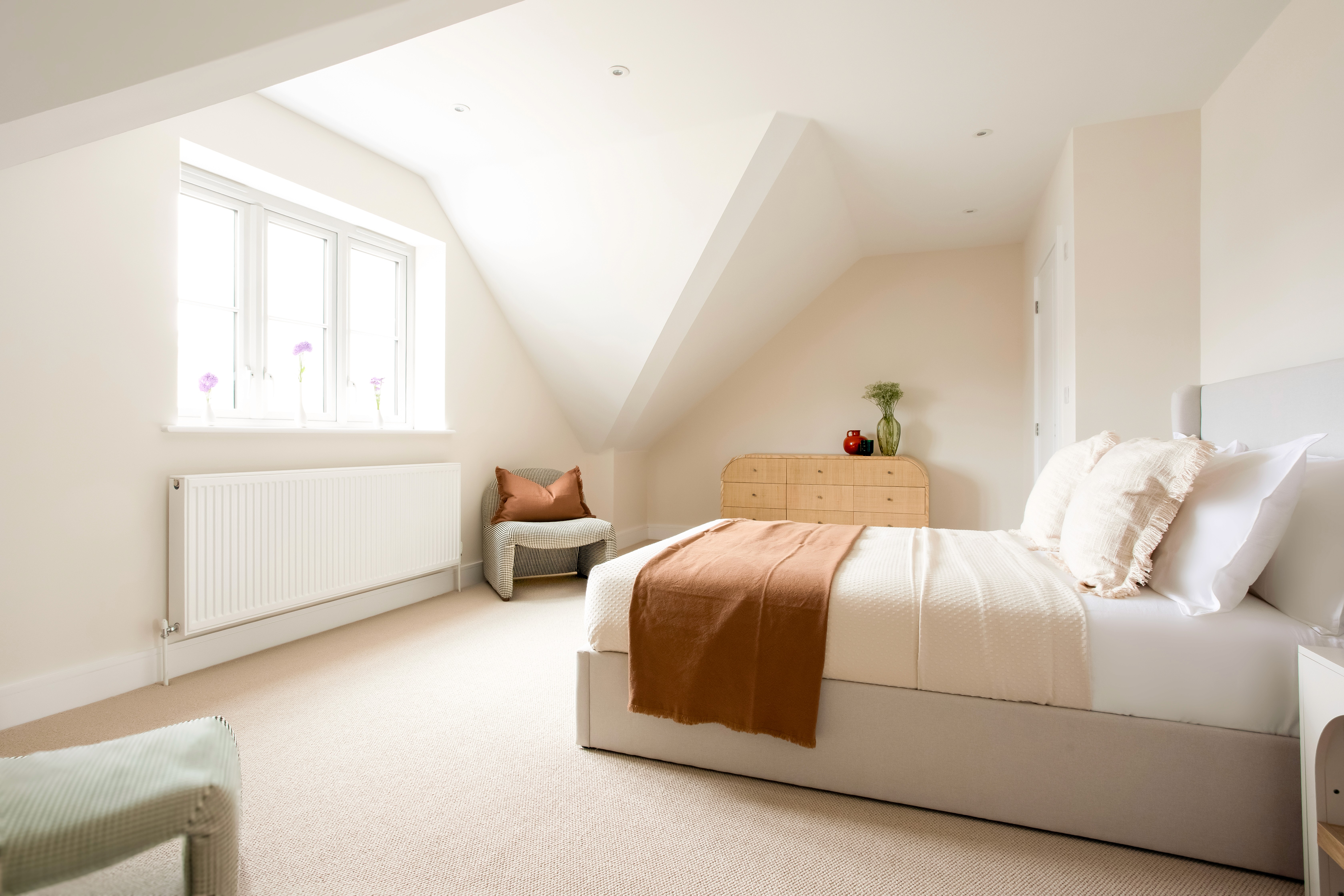 Primary bedroom with en-suite in Norah, a new-build Lewis & Scott home designed for comfortable later-life living