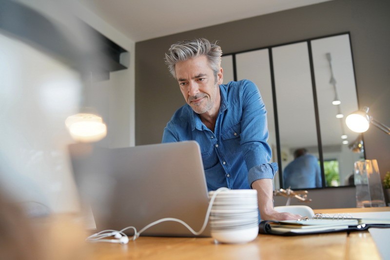 Mature man working from contemporary home
