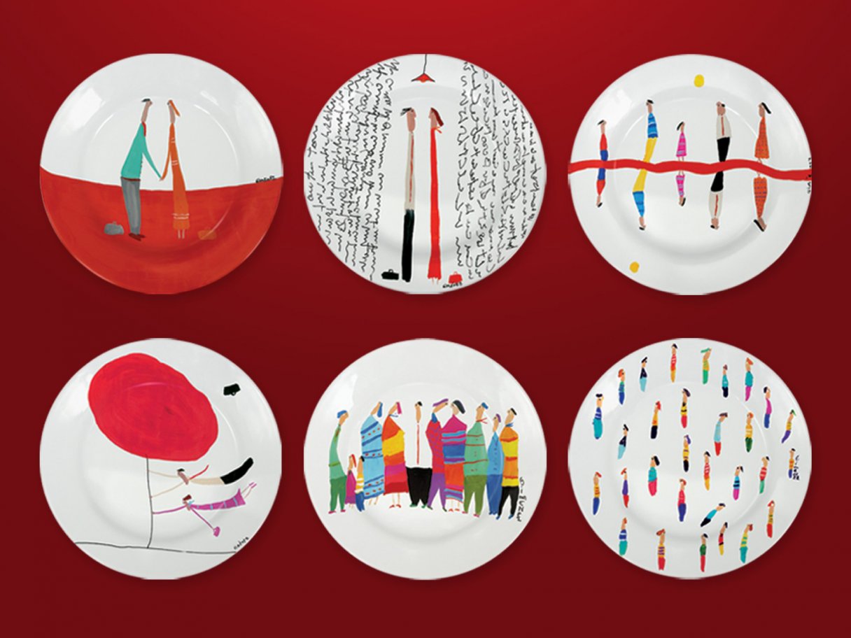 Rooftops of a coastal town with the sea in background