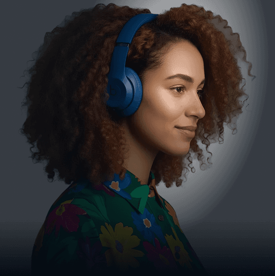 An image of a young professional learning with headphones on