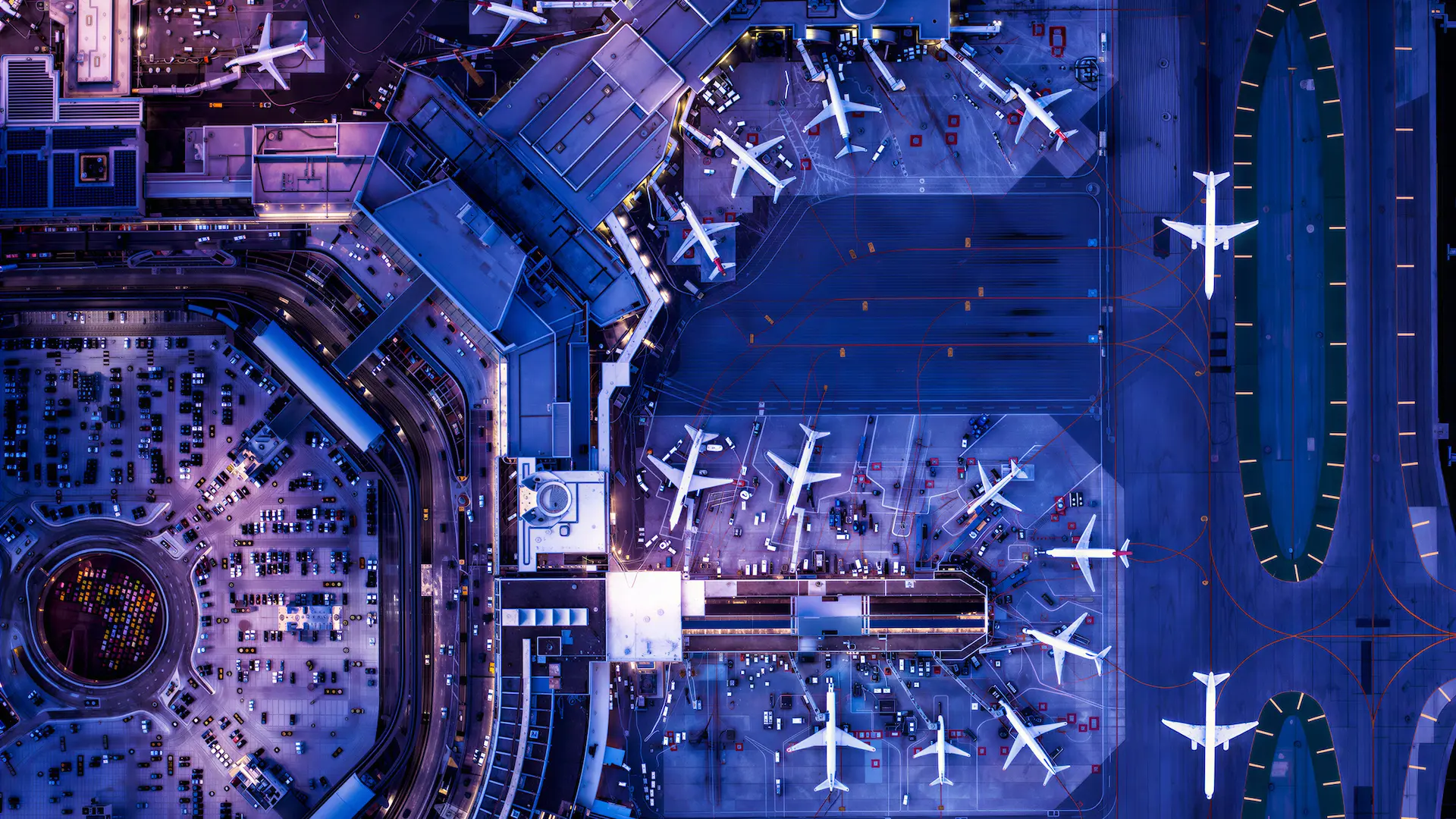 Aerial twilight view of San Francisco International Airport terminals and taxiways.