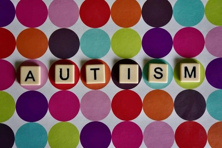 a colorful paper with the word 'autism' written on it