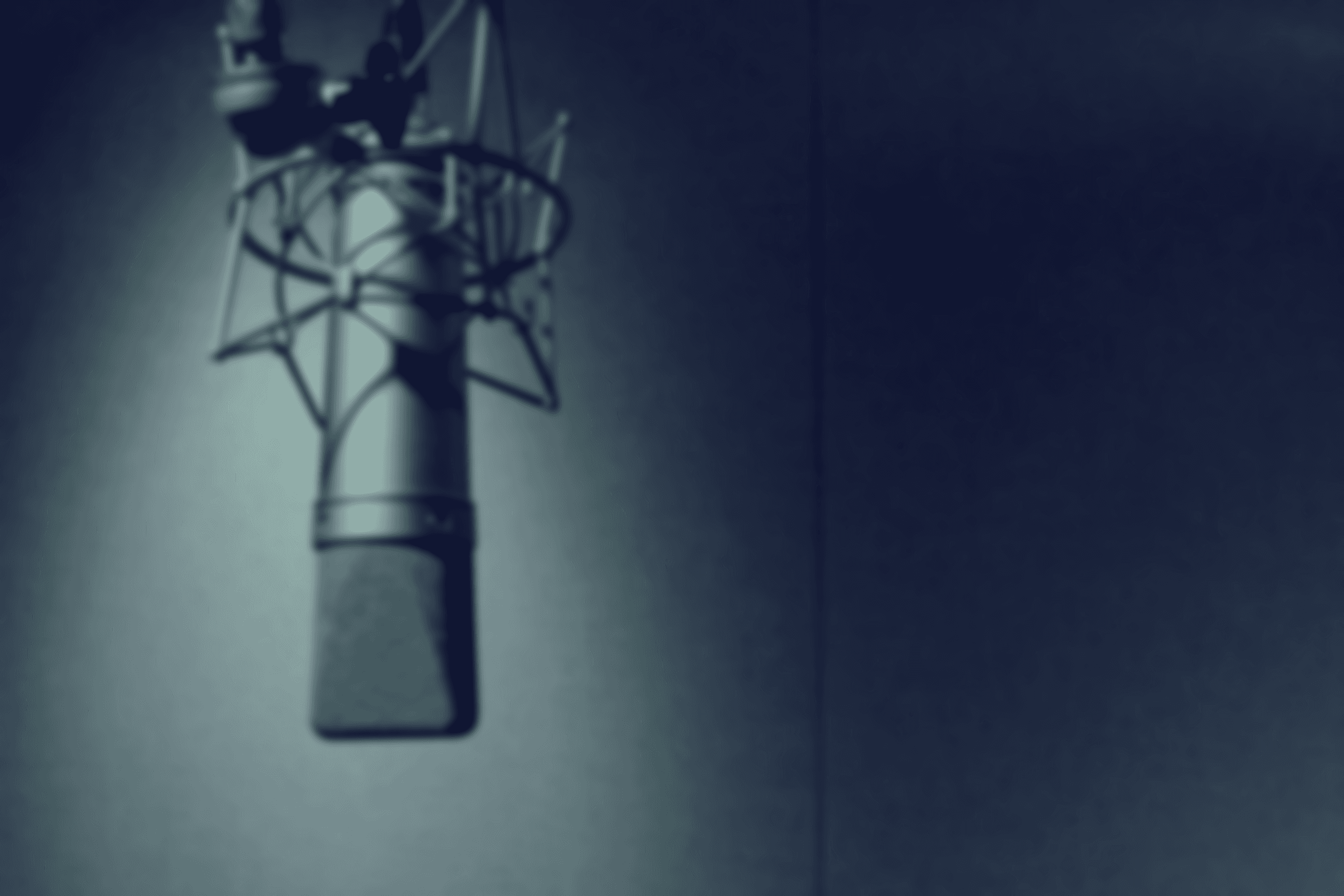 black and silver microphone on black table