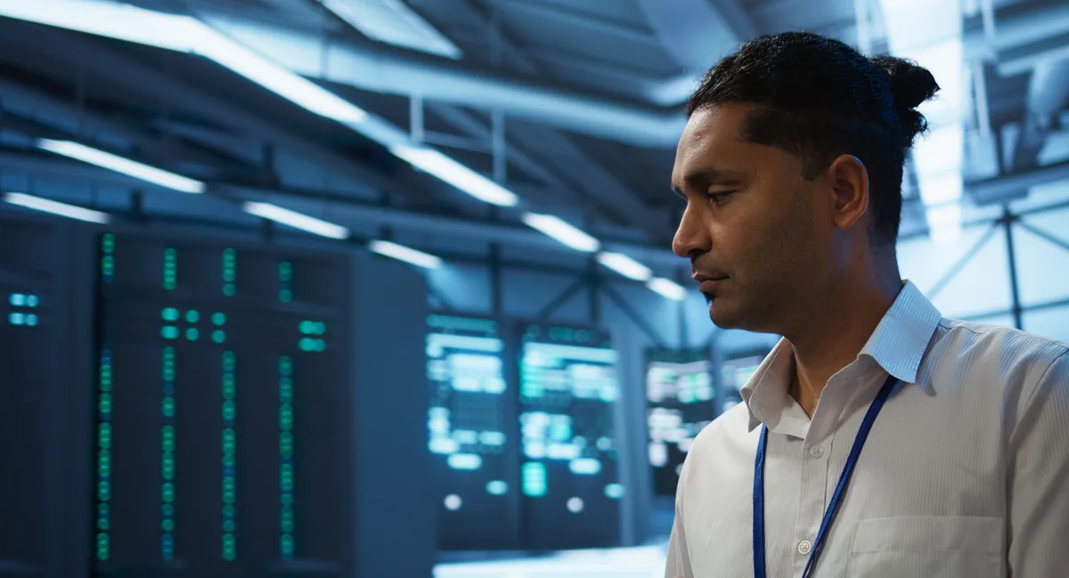 IT engineer checking systems in a server room