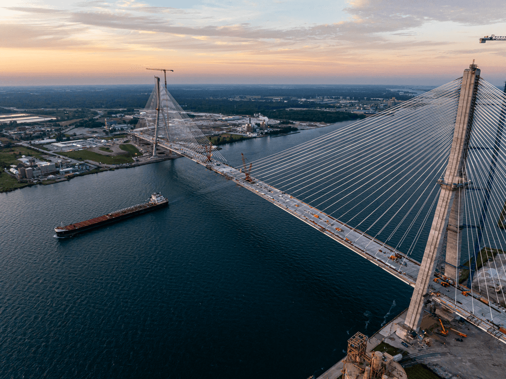 person sitting on grass and using phone