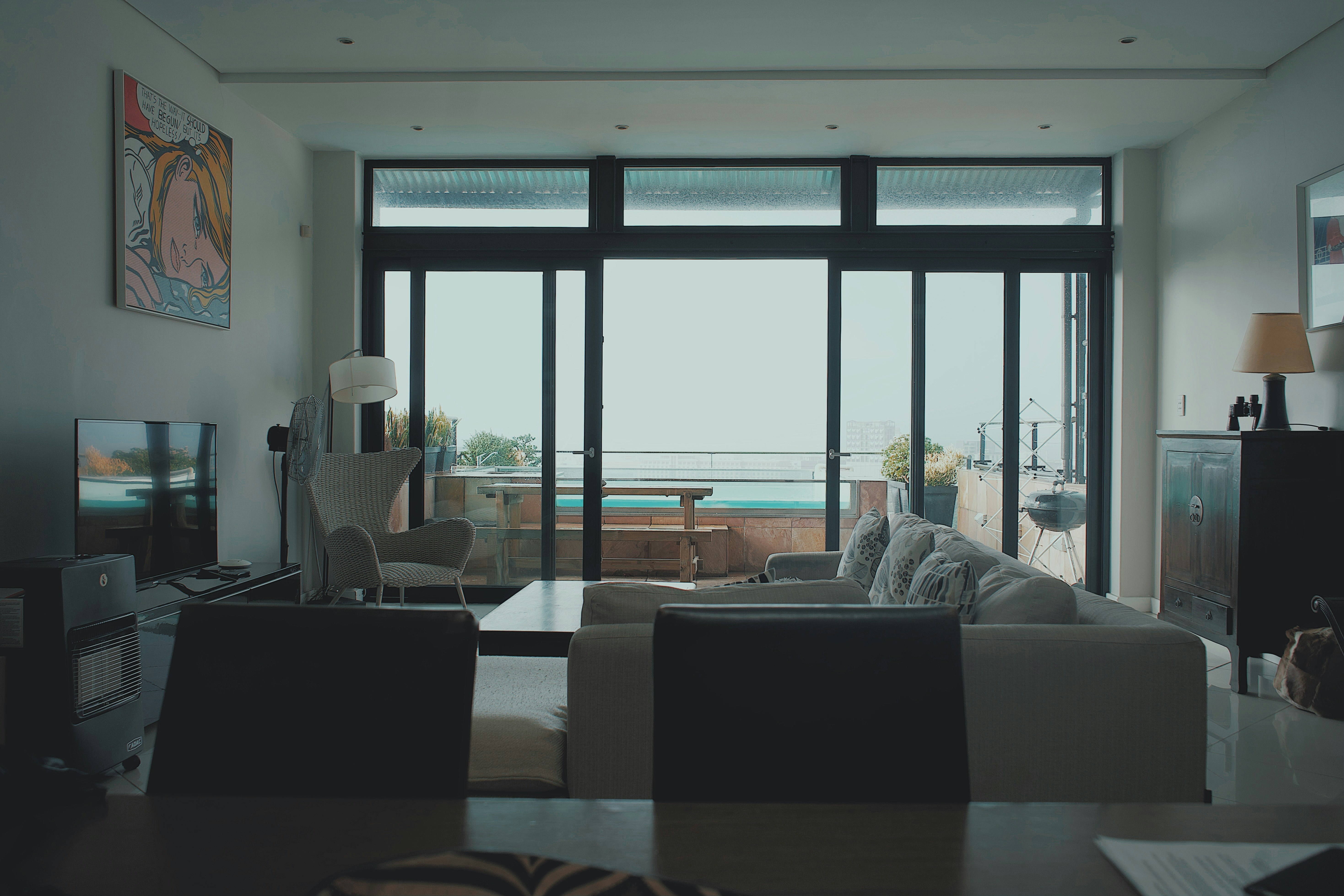 a living room filled with furniture and a flat screen tv