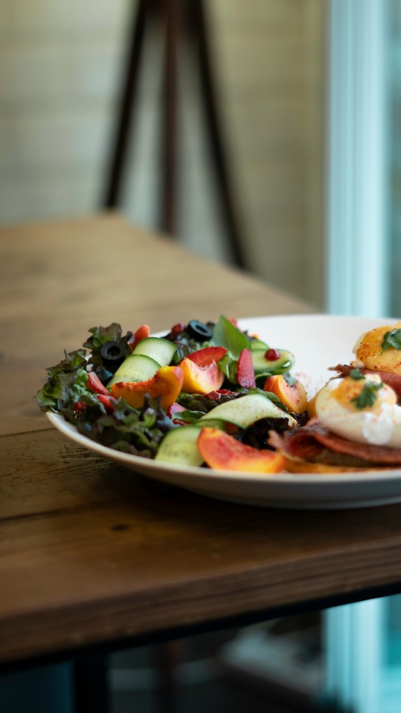 a plate of food on a wooden table