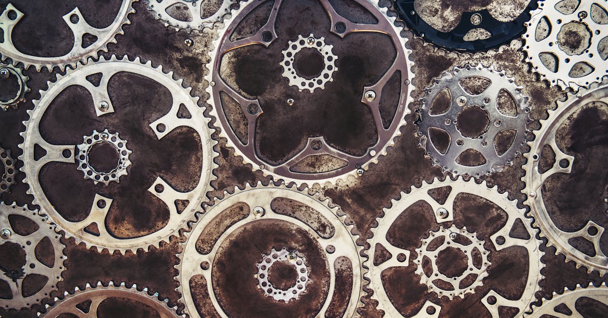Close-up of interlocking metal gears creating an industrial texture.