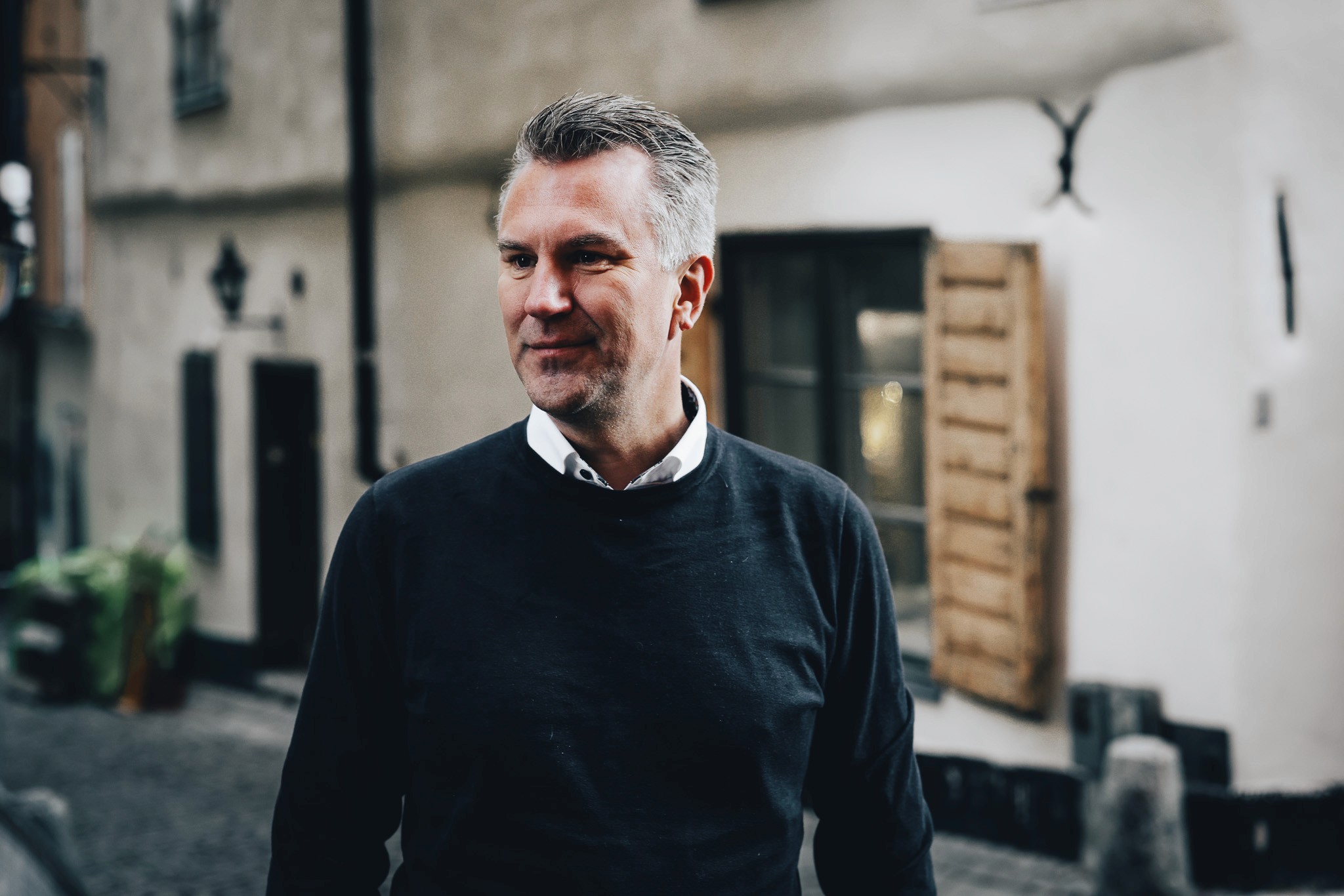 The team working together at a table with laptops, discussing business strategies or projects.