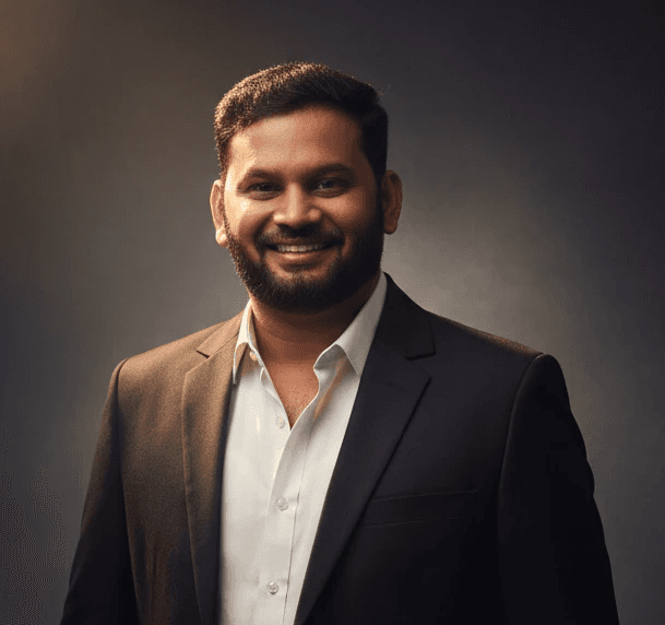 a man in a suit and tie posing for a picture