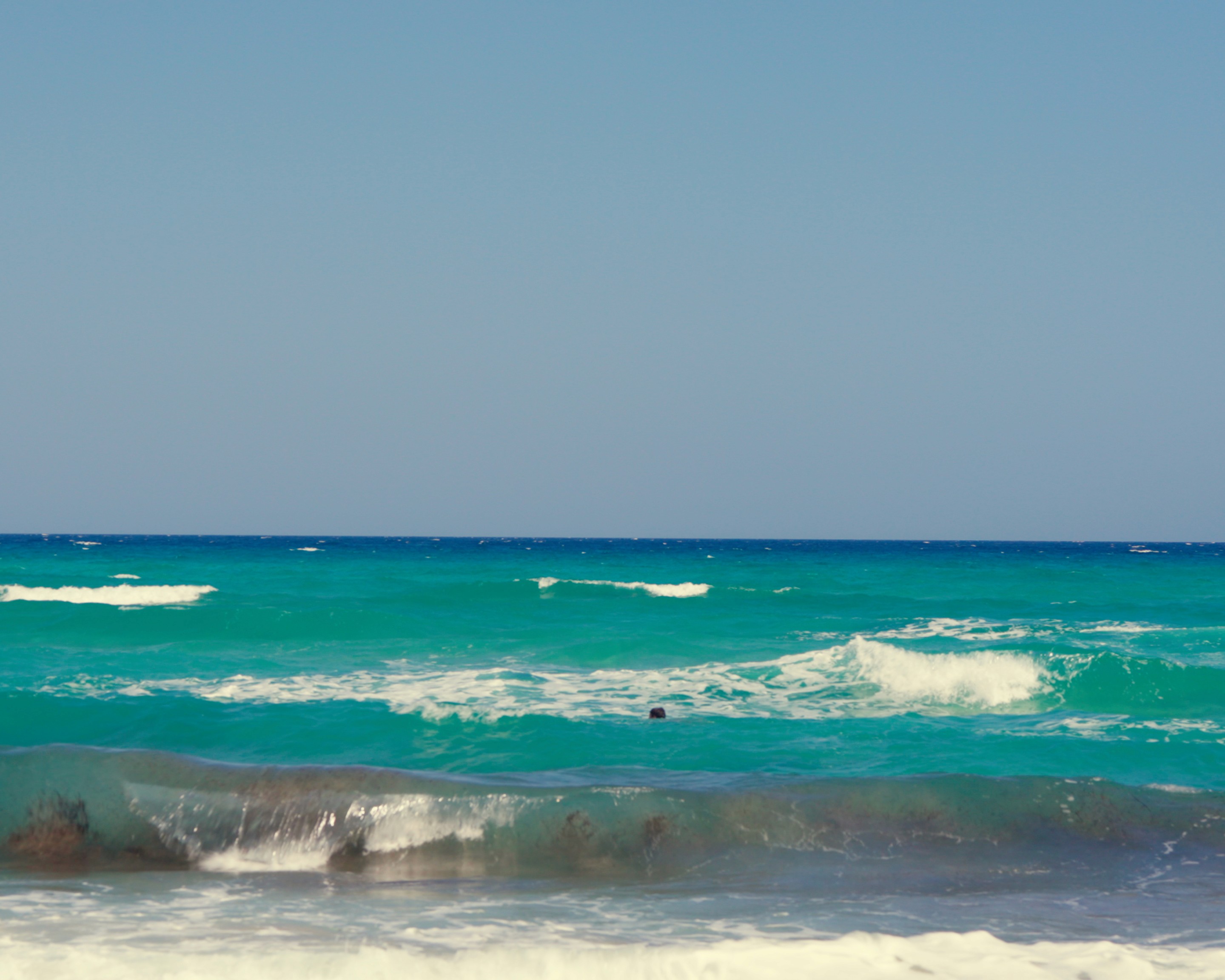Detail of the beach and water near the house