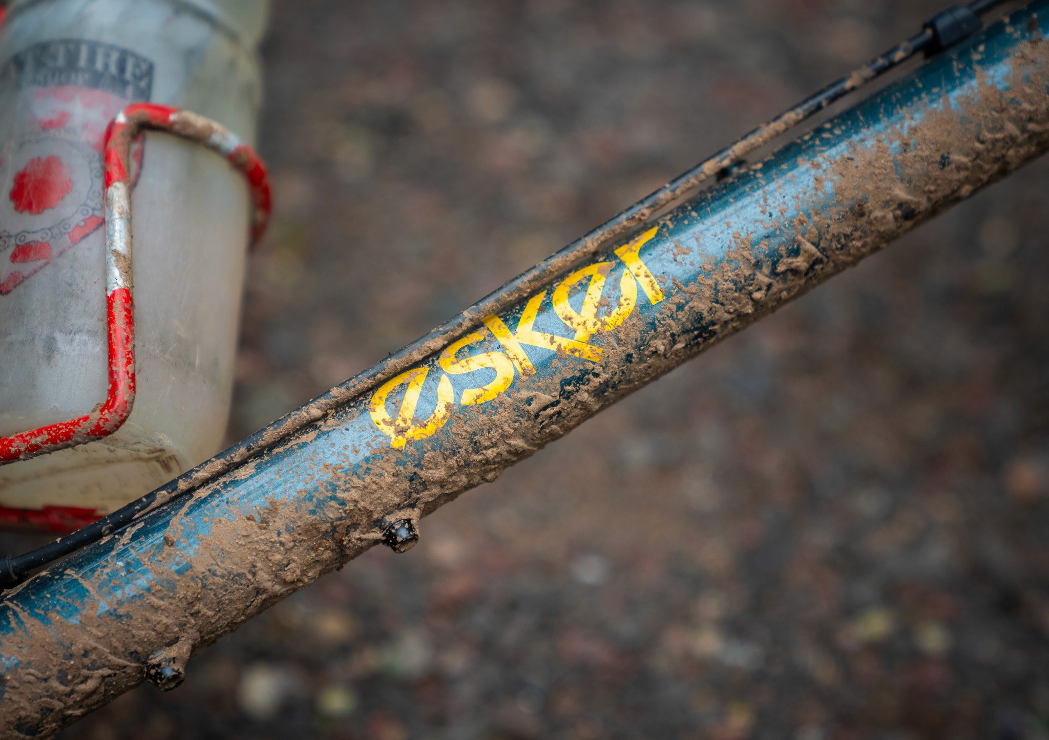 Mountain bike brand detail image with mud and outdoor texture