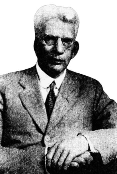 A grainy black-and-white portrait of an older man with white hair and glasses, dressed in a suit and tie, seated with one arm resting on a surface. His serious expression and formal attire, along with the vintage quality of the photograph, give the image a historical and scholarly appearance. The dark background contrasts with his light-colored suit, emphasizing his distinguished presence.