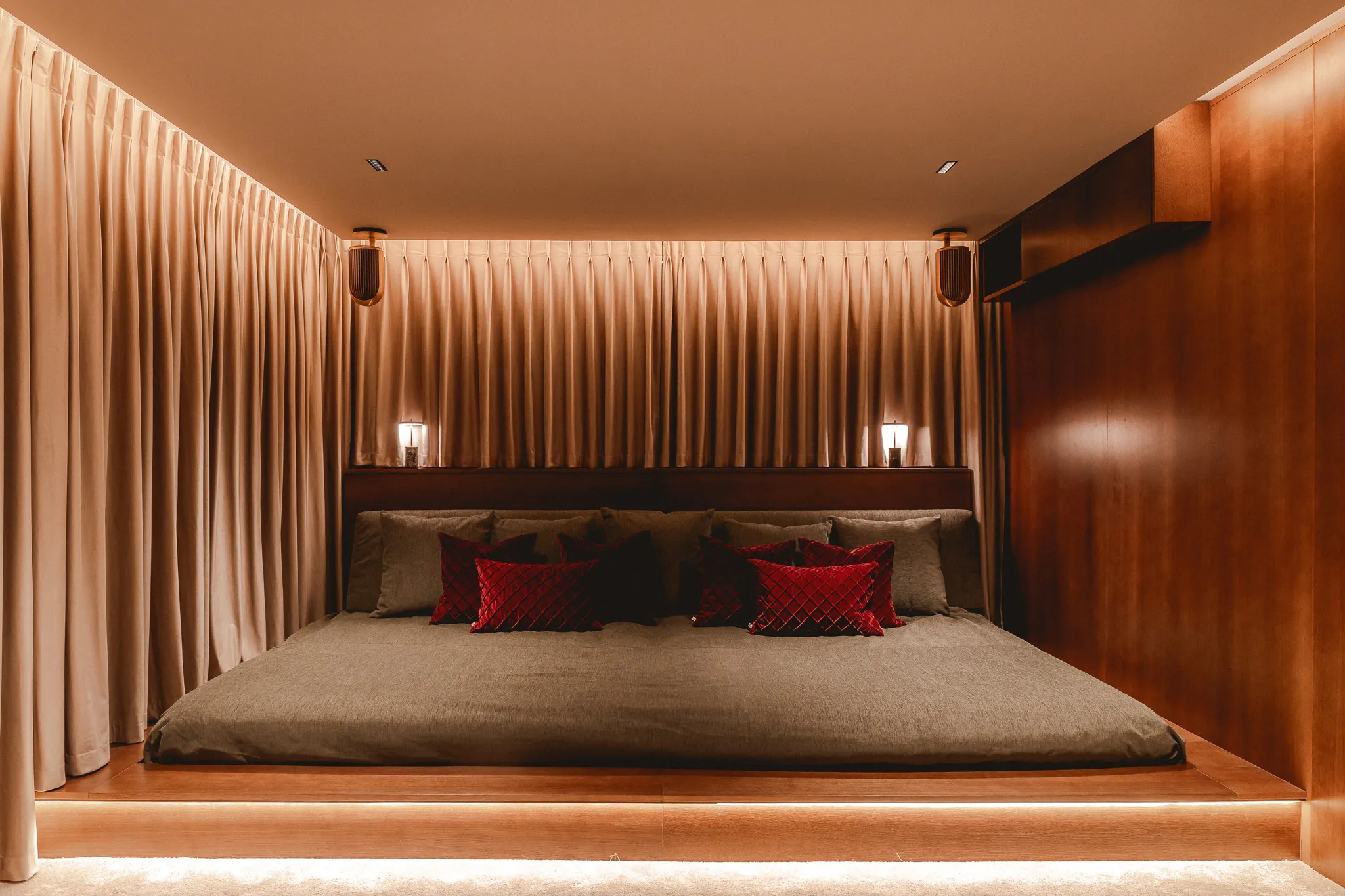 Bespoke private home cinema with custom timber joinery, integrated lighting and luxury seating.