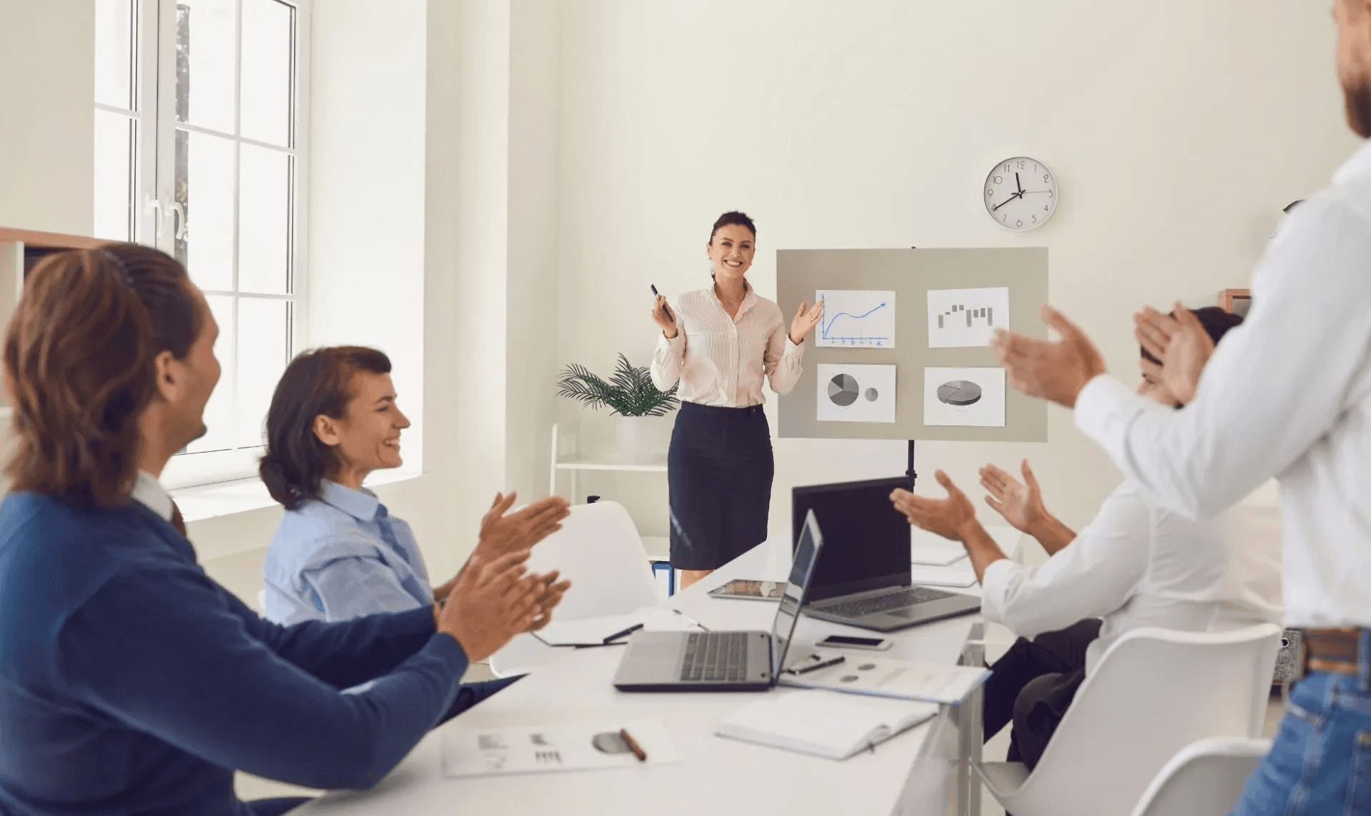 Colleagues applauding woman - Lead Qualification Best Practices