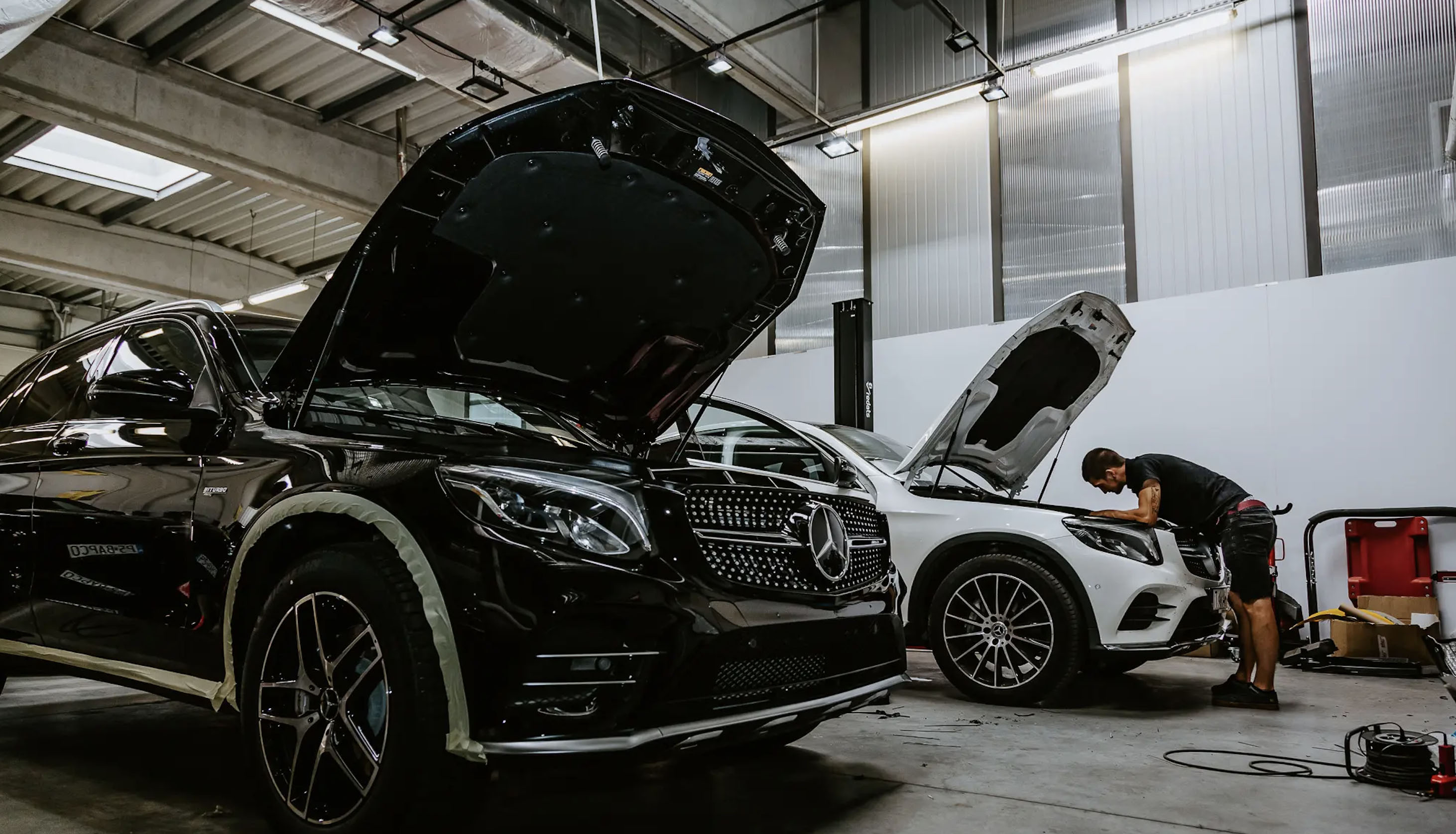 black mercedes car in a service shop