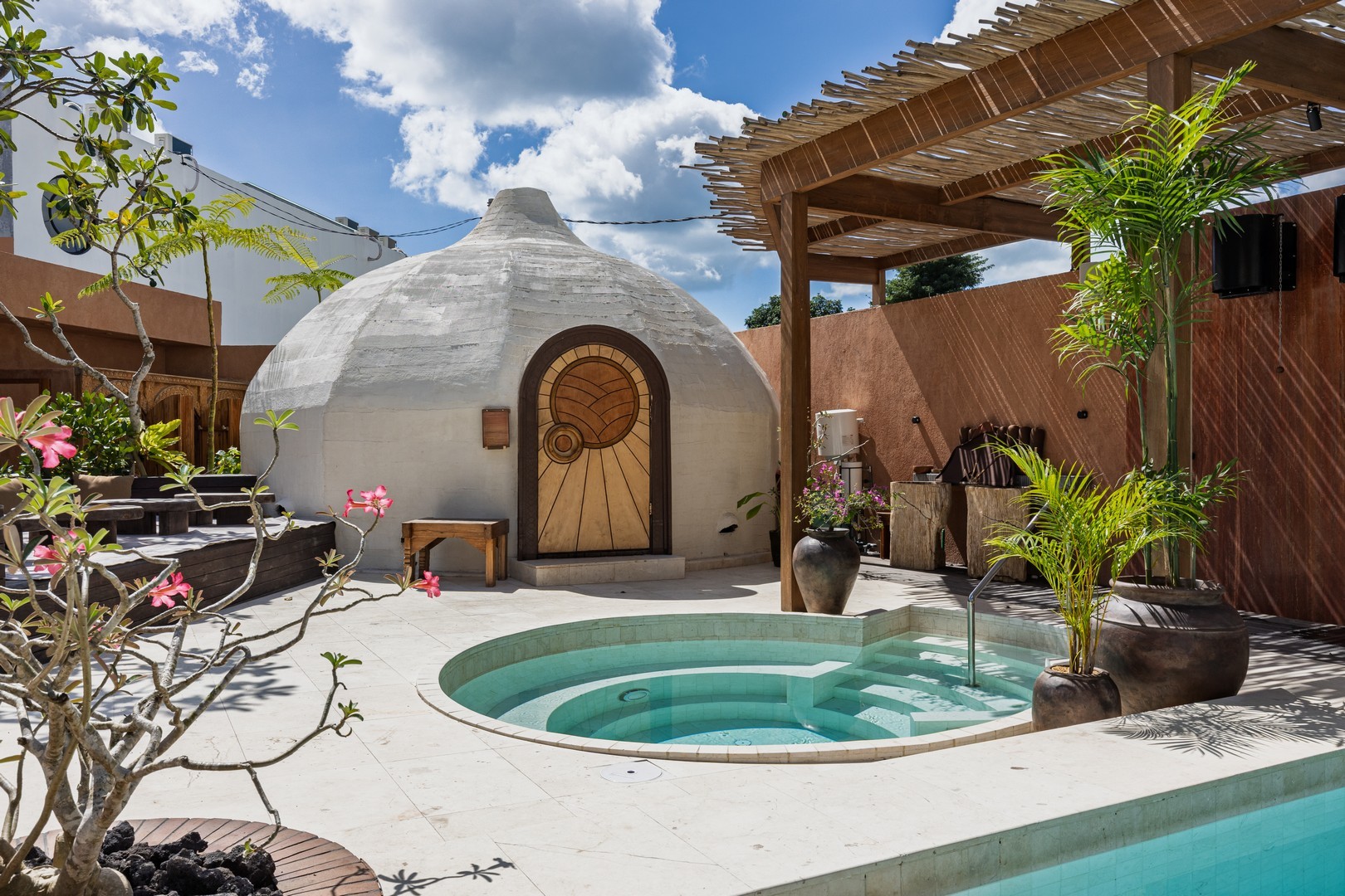 Shadow of a person holding a phone on a court