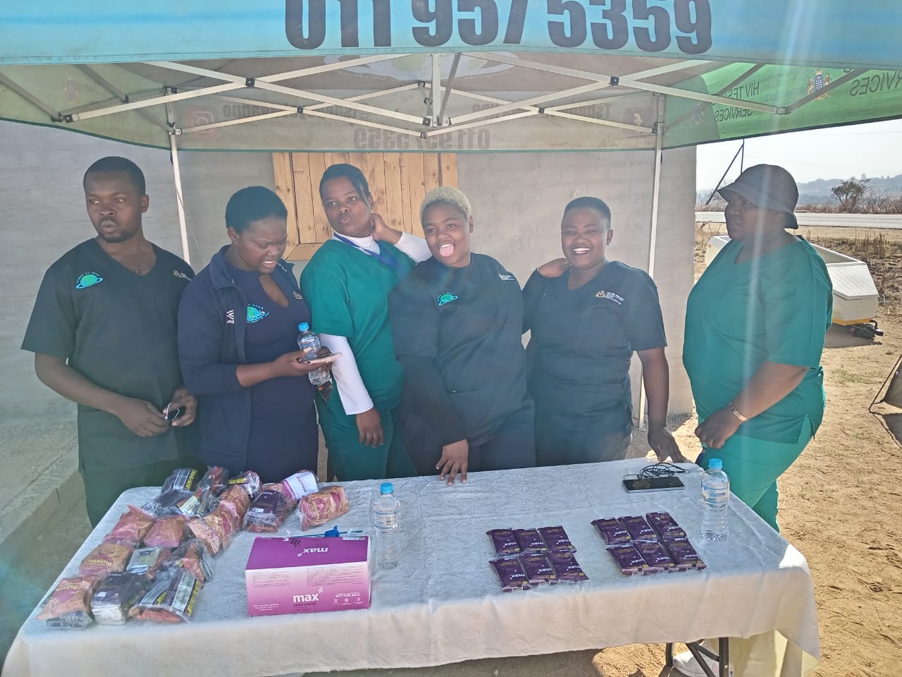 Close-up of blue flowers, glistening with droplets of water, creating a serene and calming atmosphere.