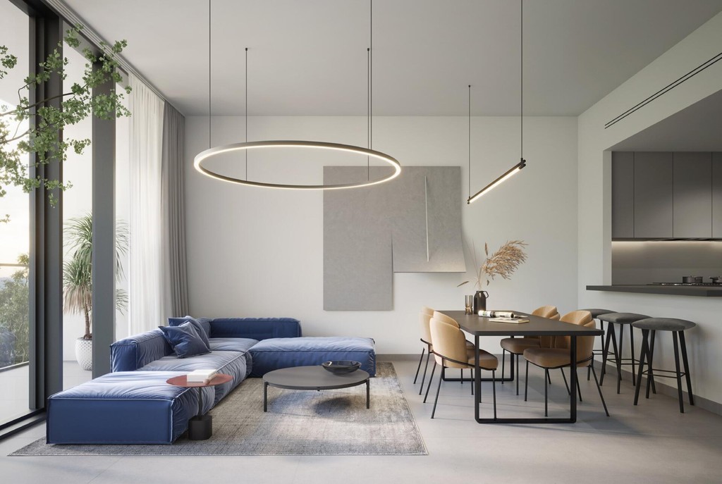 A modern living room featuring a large window and a dining table, showcasing a stylish and inviting atmosphere at The Gate 5.