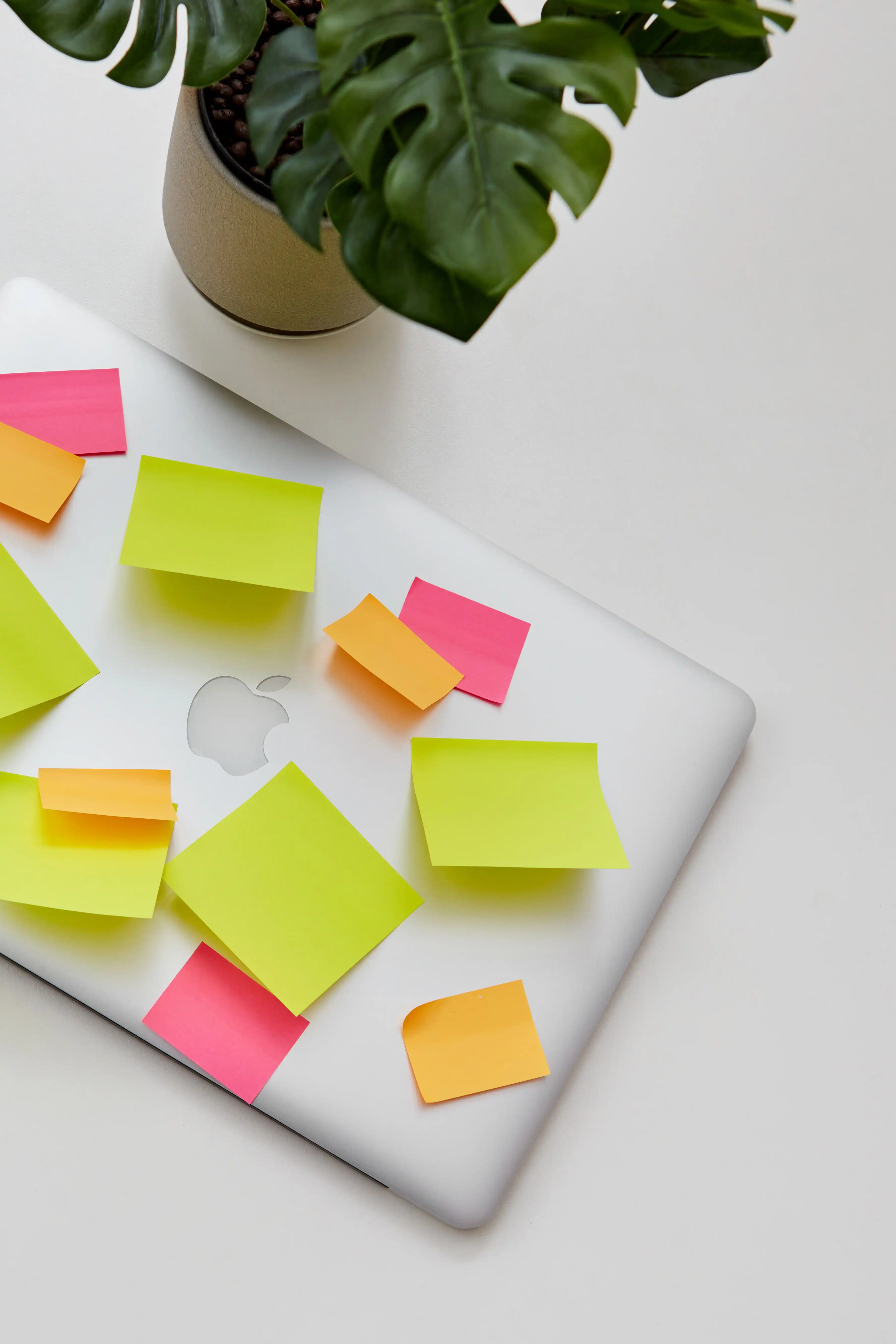 laptop with a bunch of sticky notes