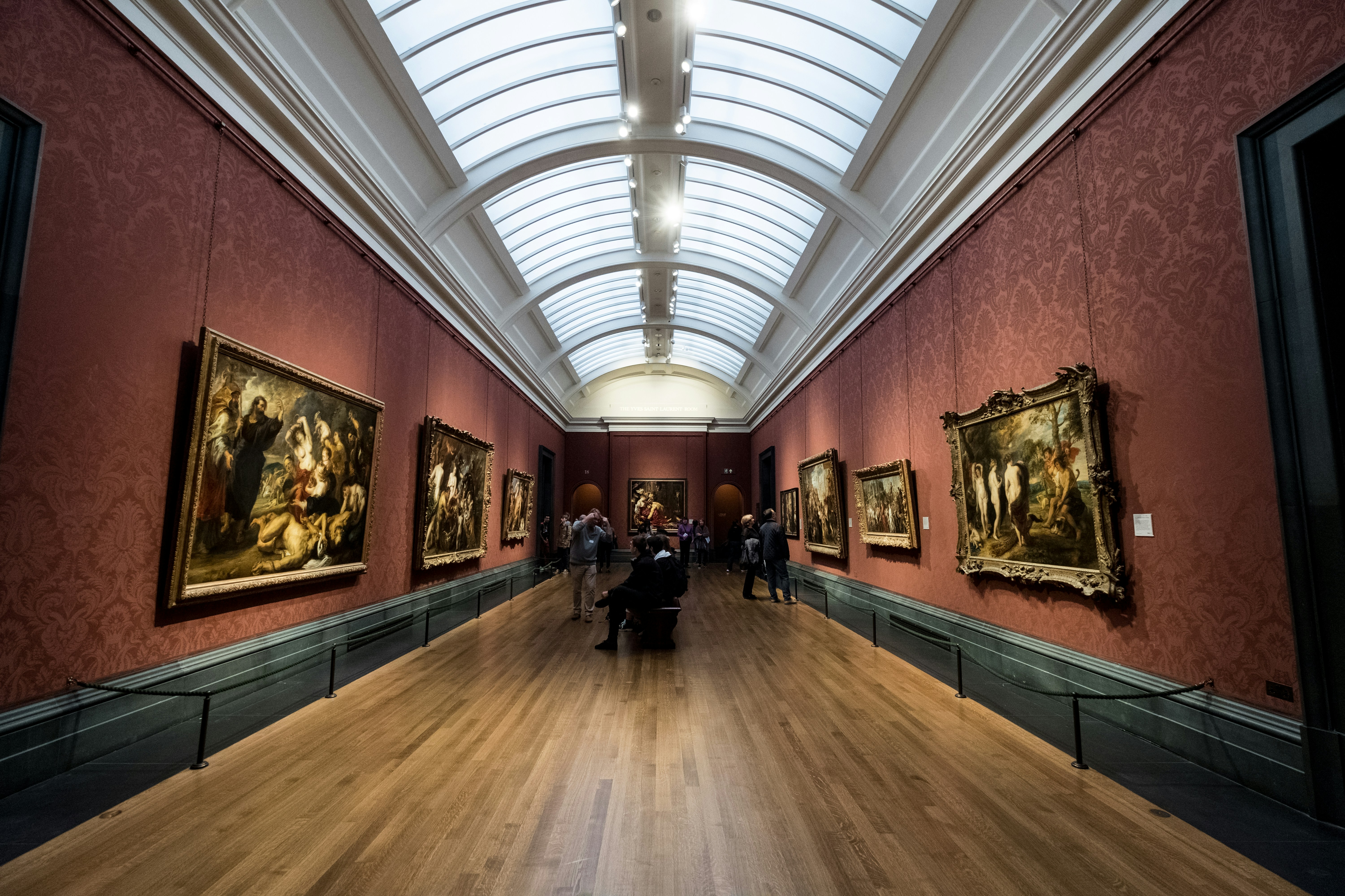 A hall adorned with traditional-style paintings.