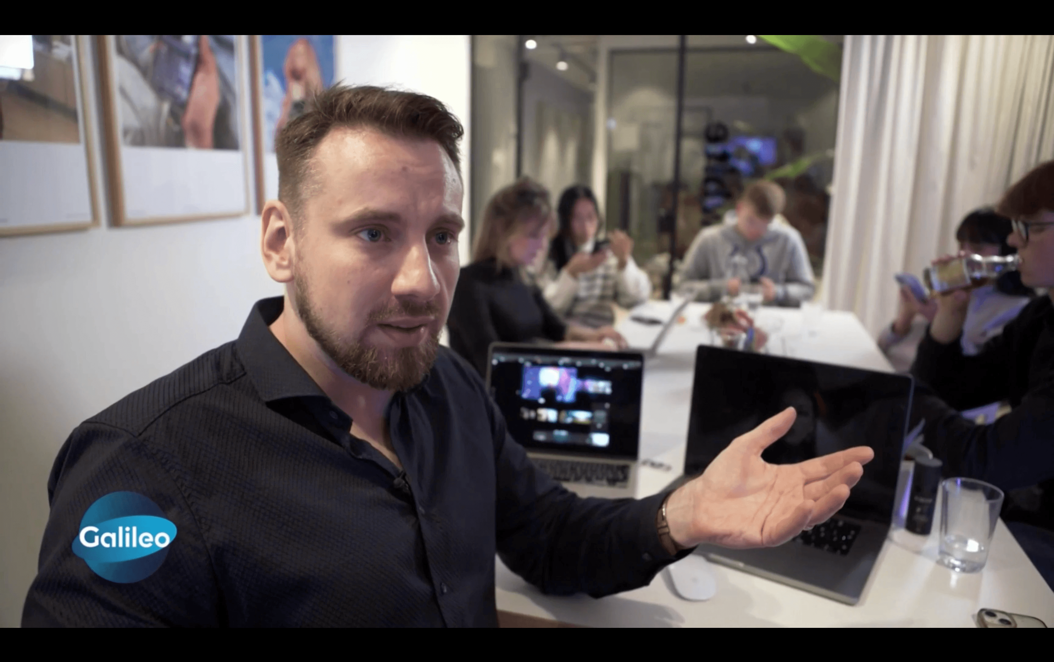 Close-up of an eye with creative makeup and white feathers.