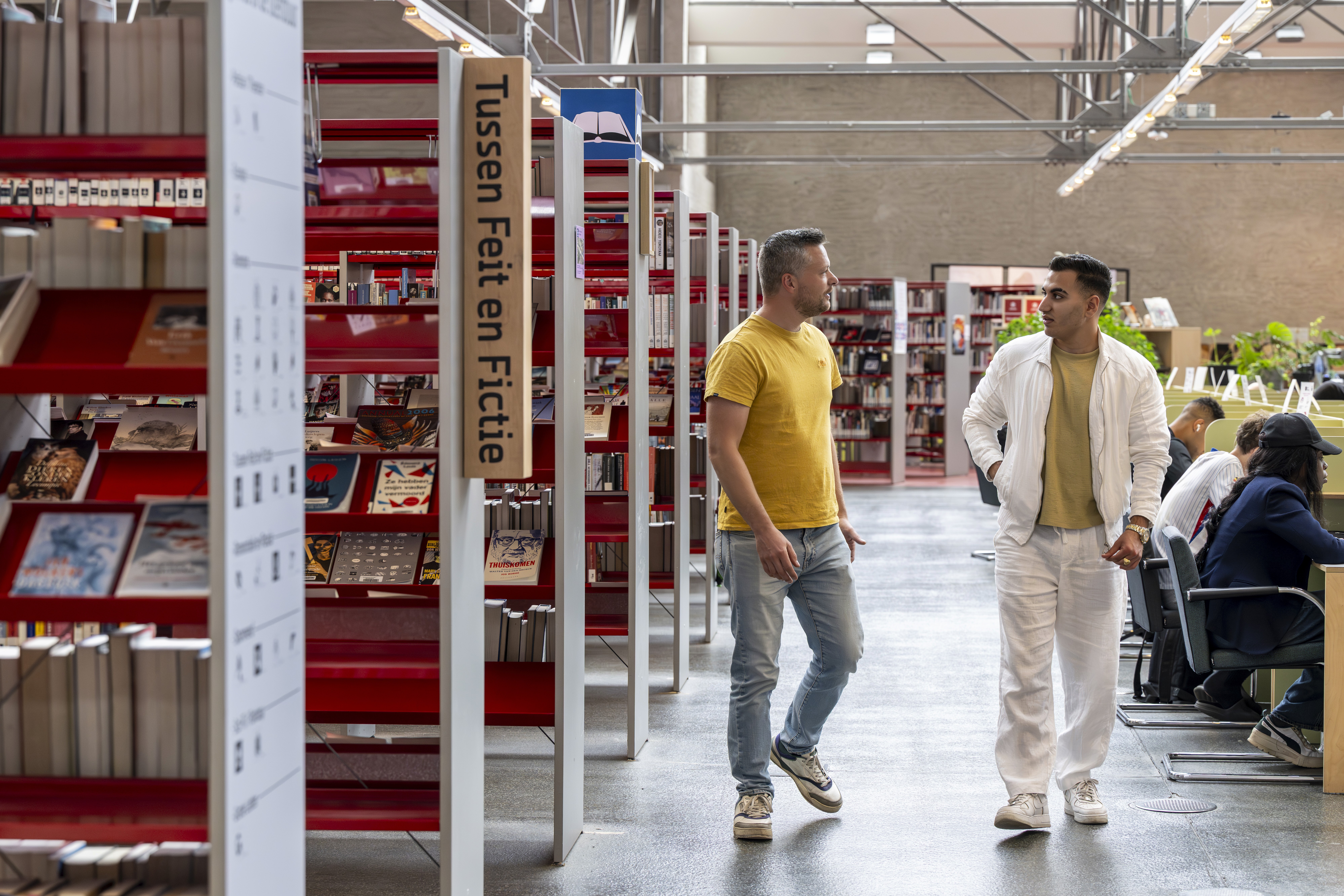 boy in blue shirt screaming near boy in green crew-neck shirt
