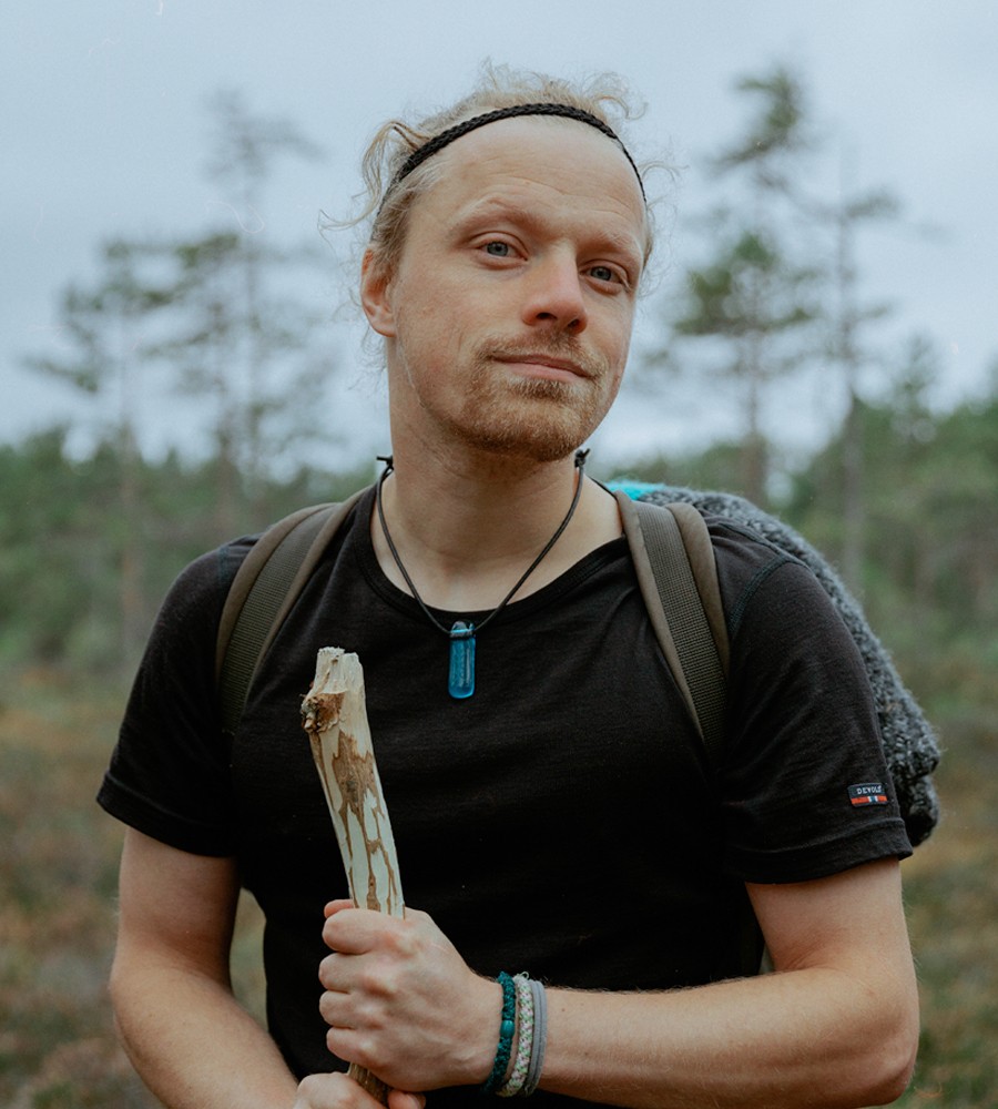 A man (Moddi) standing in a forest