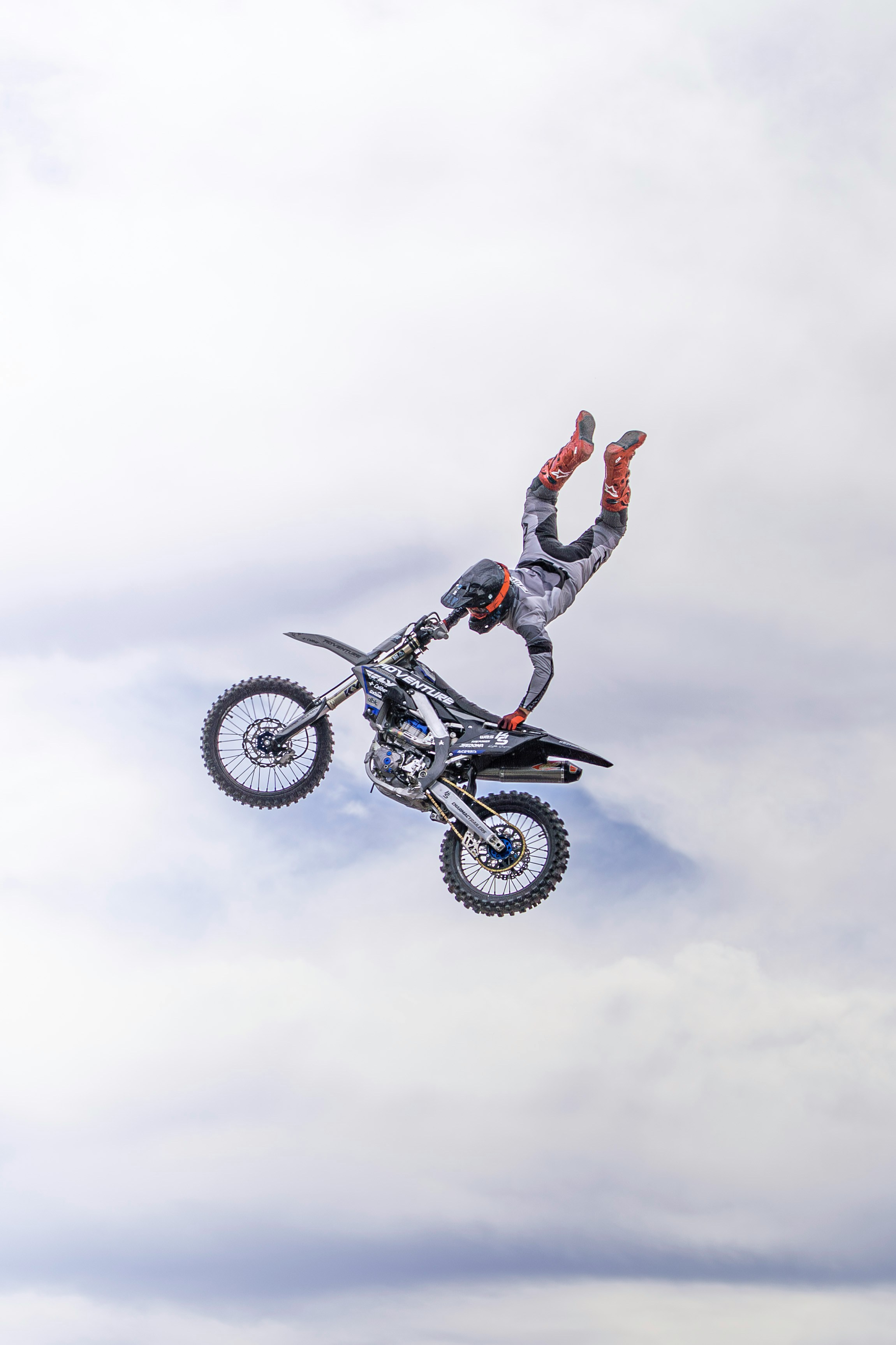 Motocross rider performing a trick mid-air