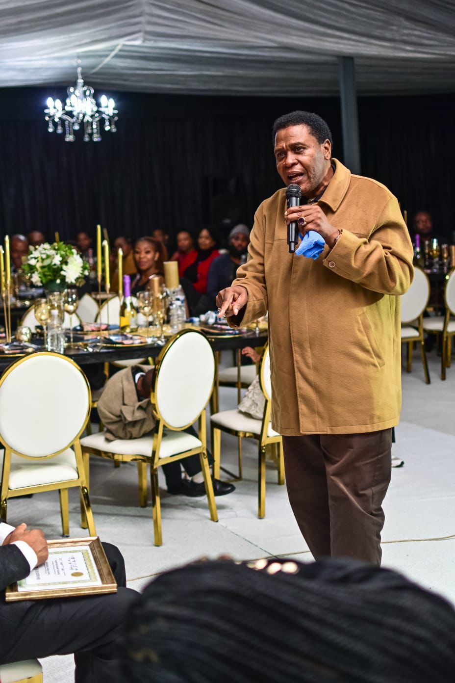 A man standing with Sufboard