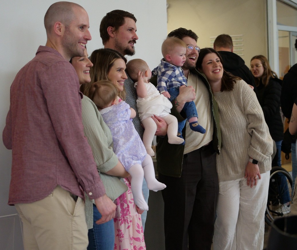 Some families taking a picture together at Base City