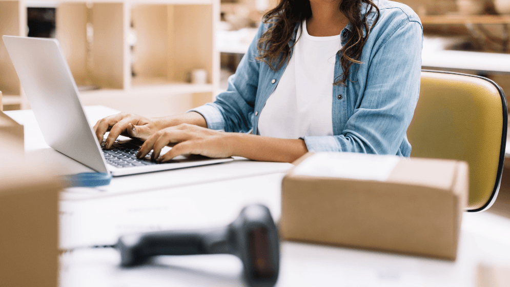 A Malaysian business owner on her laptop