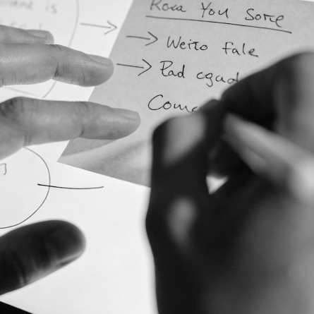 Closeup shot of hands interacting with a tablet