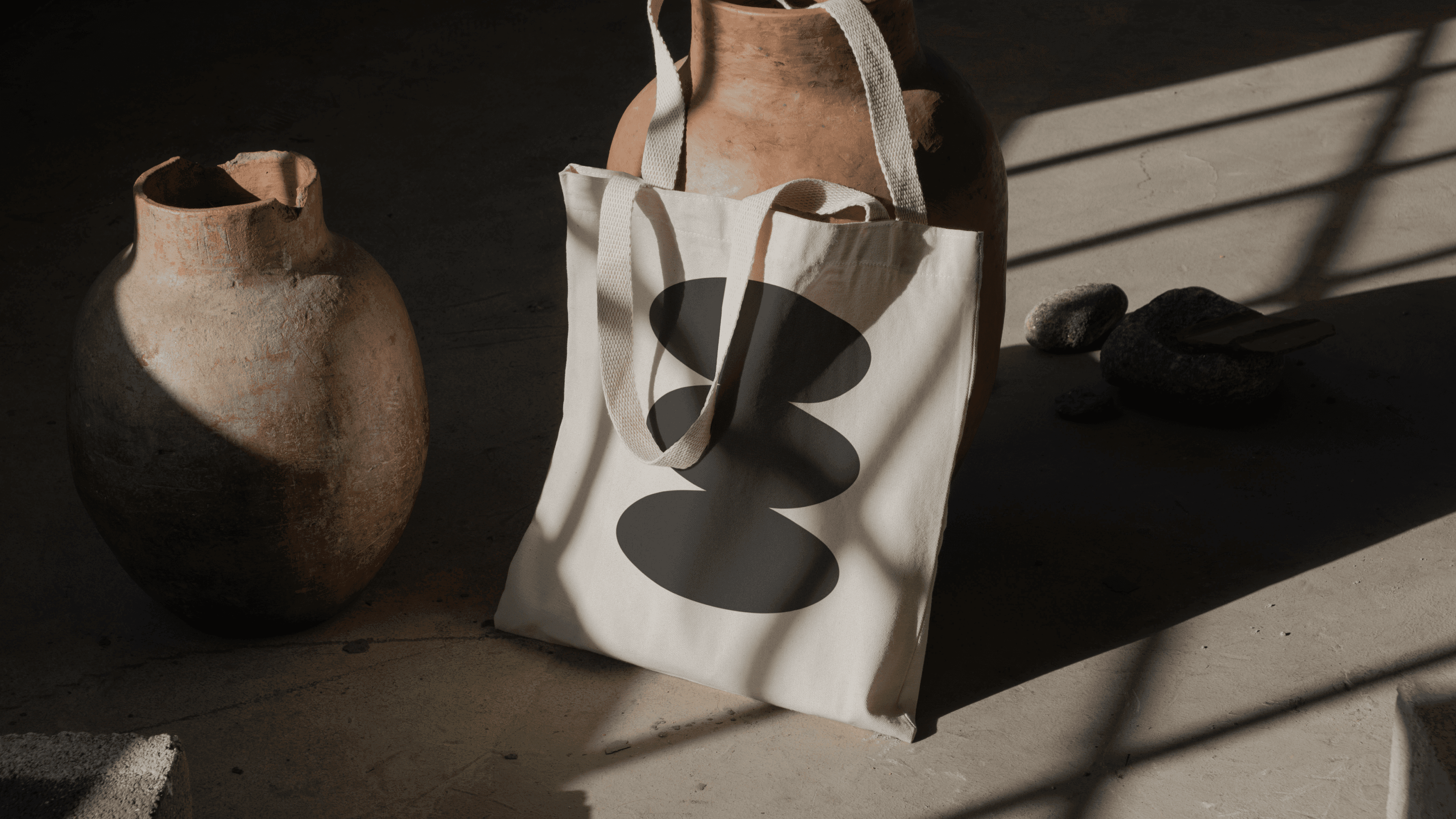 Image of a a beige cotton totebag with Figures logo.