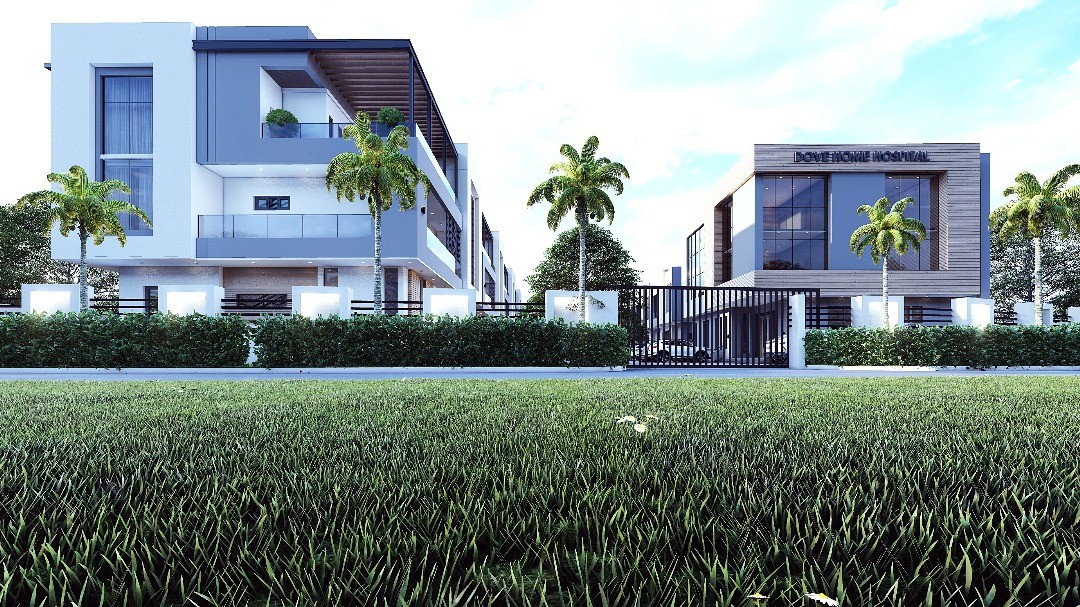 Five-story modern brick building with large windows and balconies, surrounded by lush greenery and a small pond in the foreground. Tranquil, natural setting.