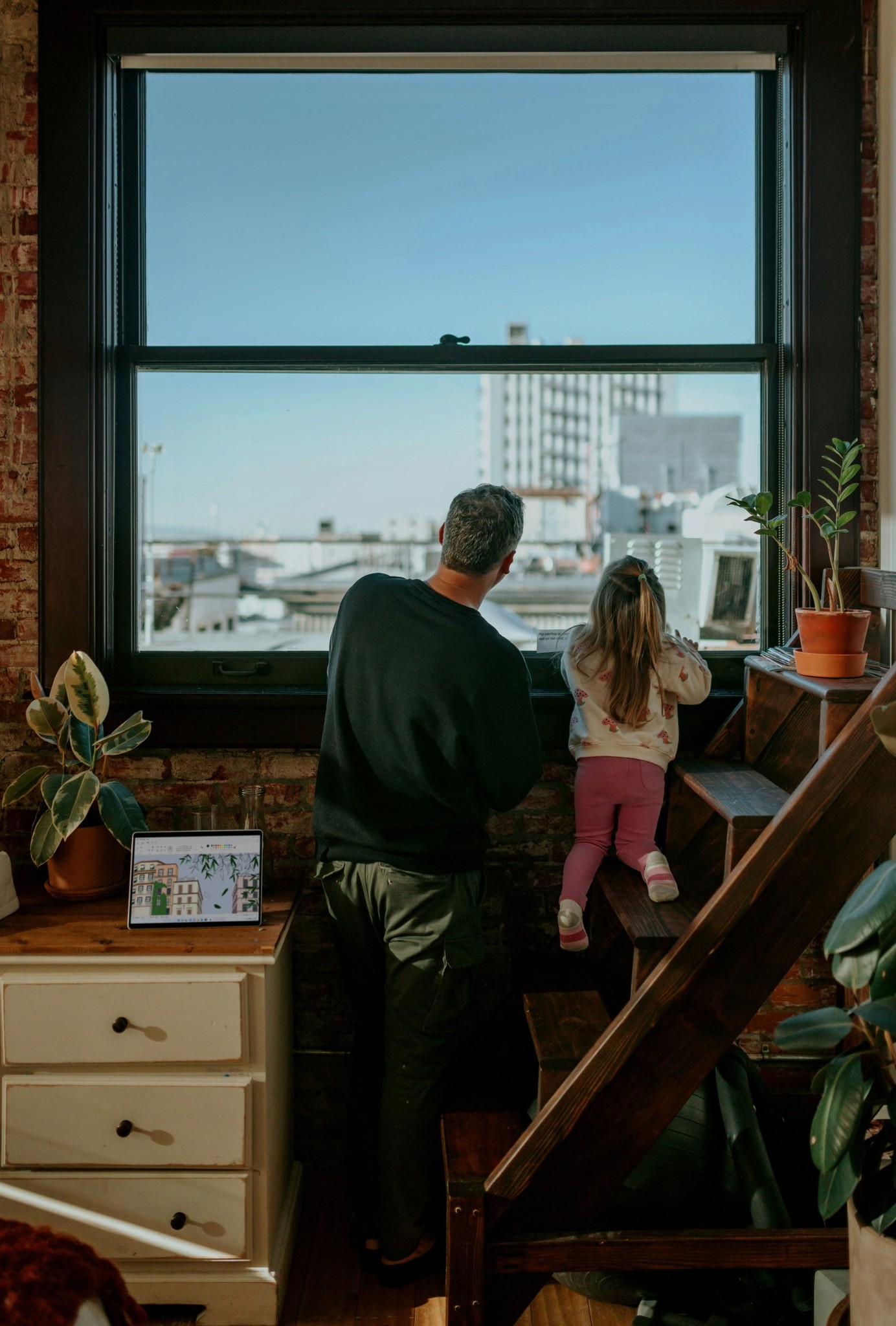 Family looking out the Window