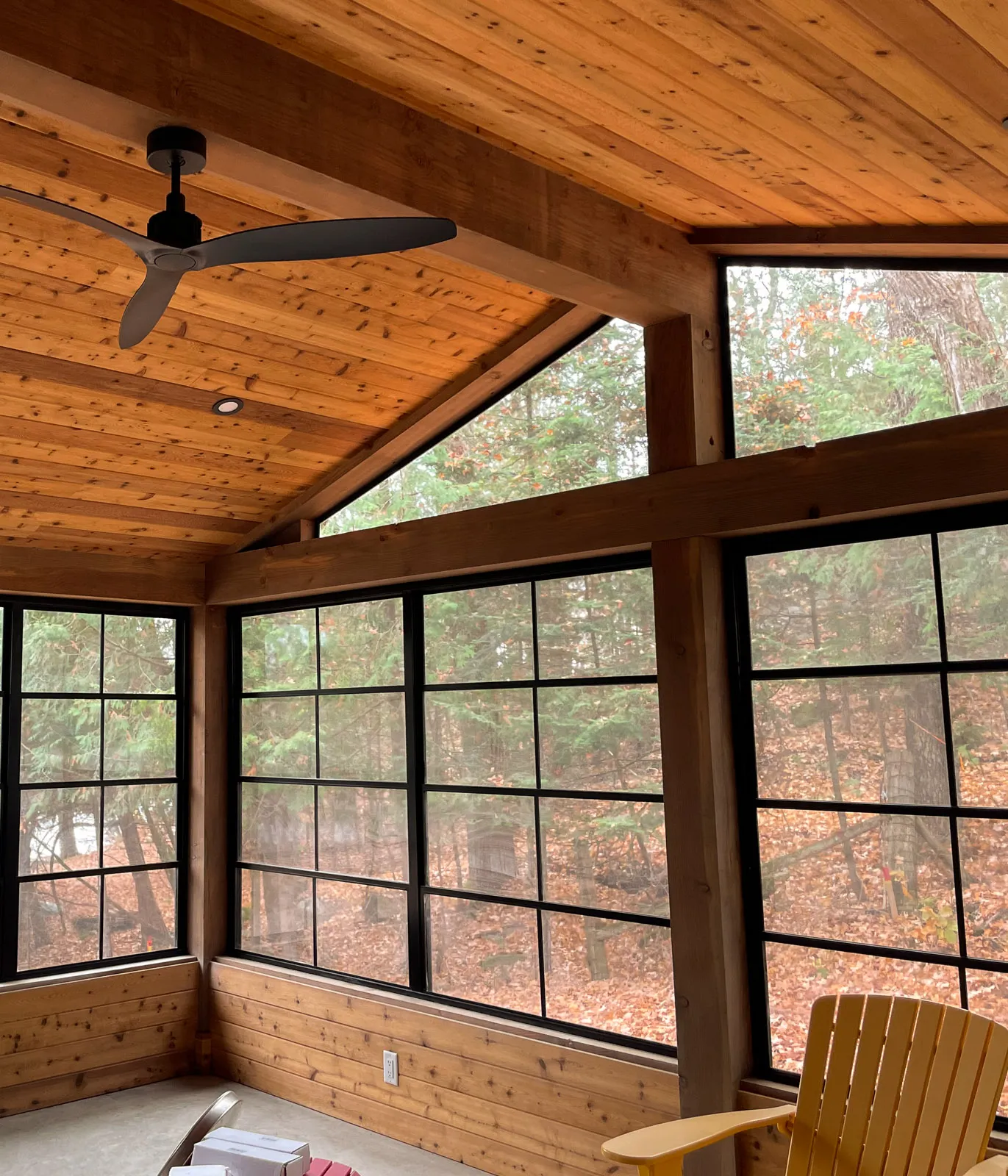 custom timber-framed sun room with view of haliburton highlands.