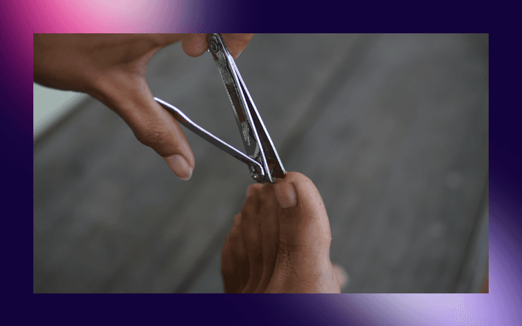 Close-up of a person trimming toenails, one of the personal grooming practices recommended for Muslims to perform on a Friday.