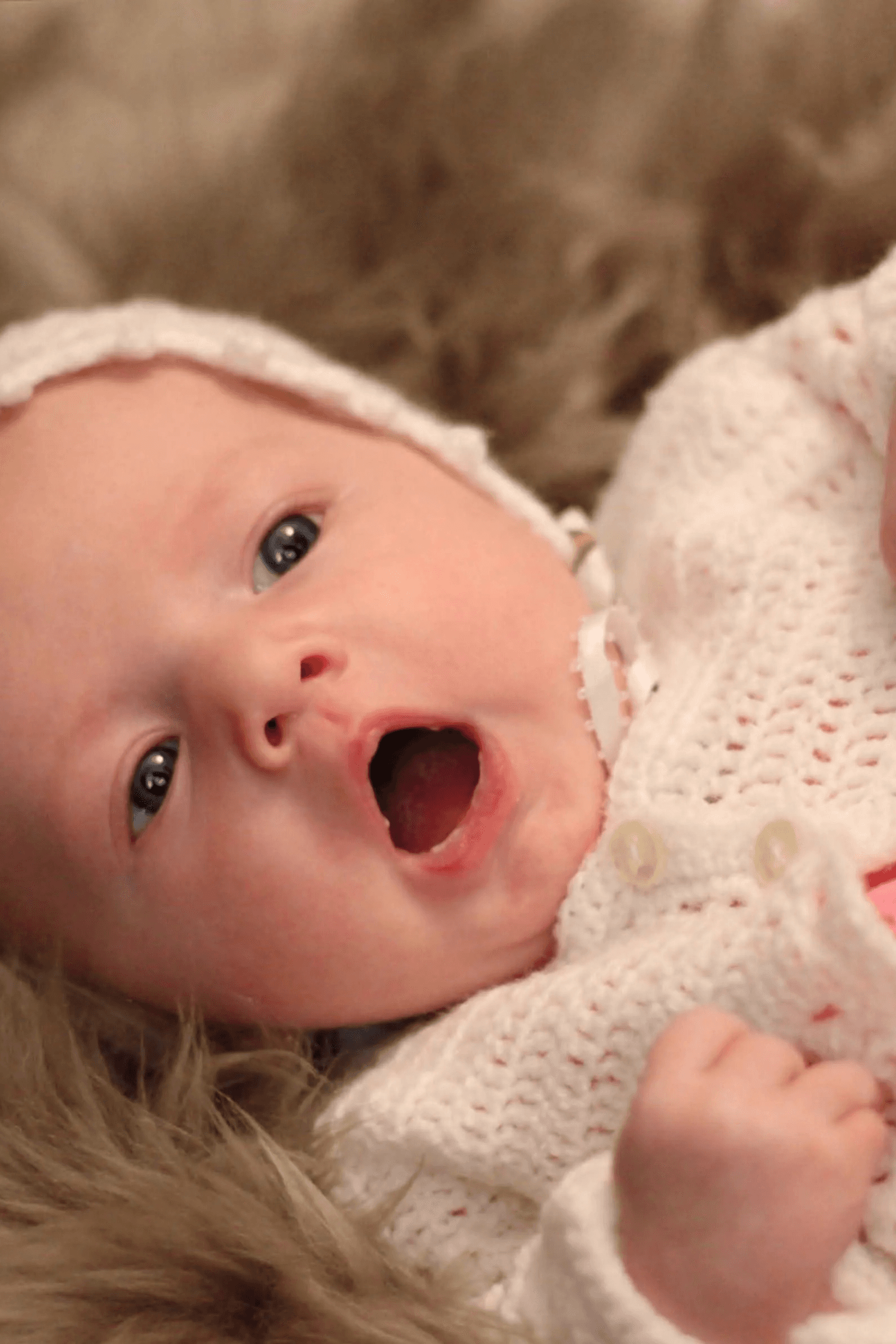 A couple stands closely in an intimate embrace.