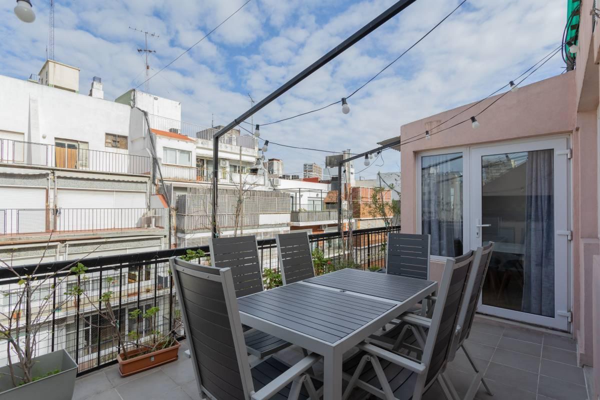 white sofa chair near fireplace