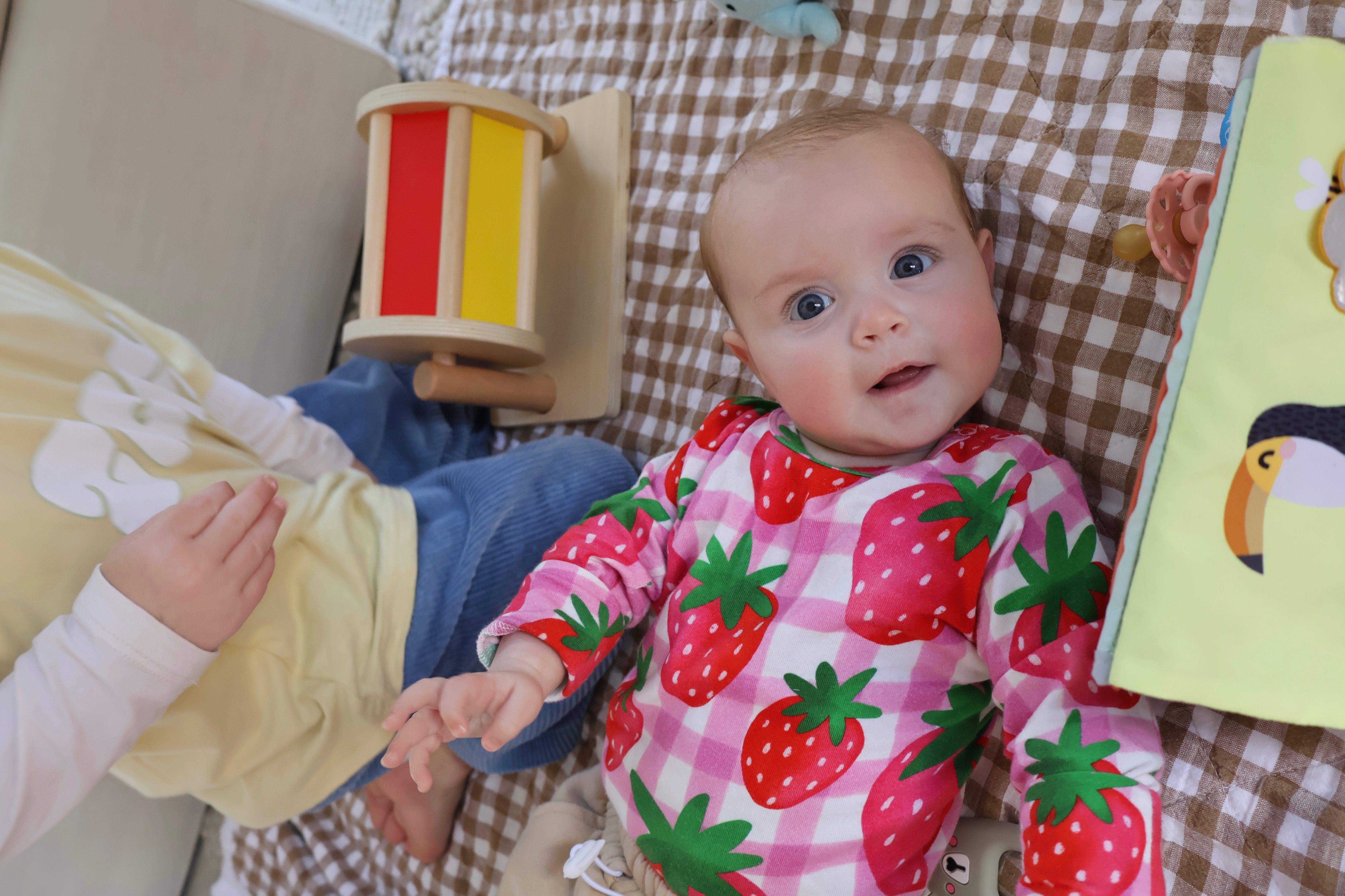 Six-month-old baby girl featured as a tribute to common milestone misconceptions.