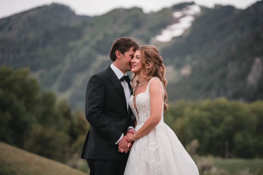 Bride and groom portrait with mountain views at Aspen Meadows Resort Wedding