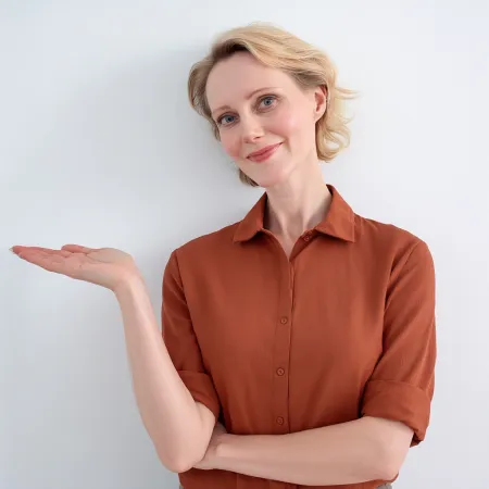 Midlife woman in terracotta shirt presenting menopause symptom education AI prompt pack for menopause coaches