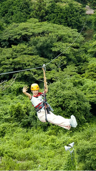 A futuristic female warrior in chrome armor holding a glowing blue sword
