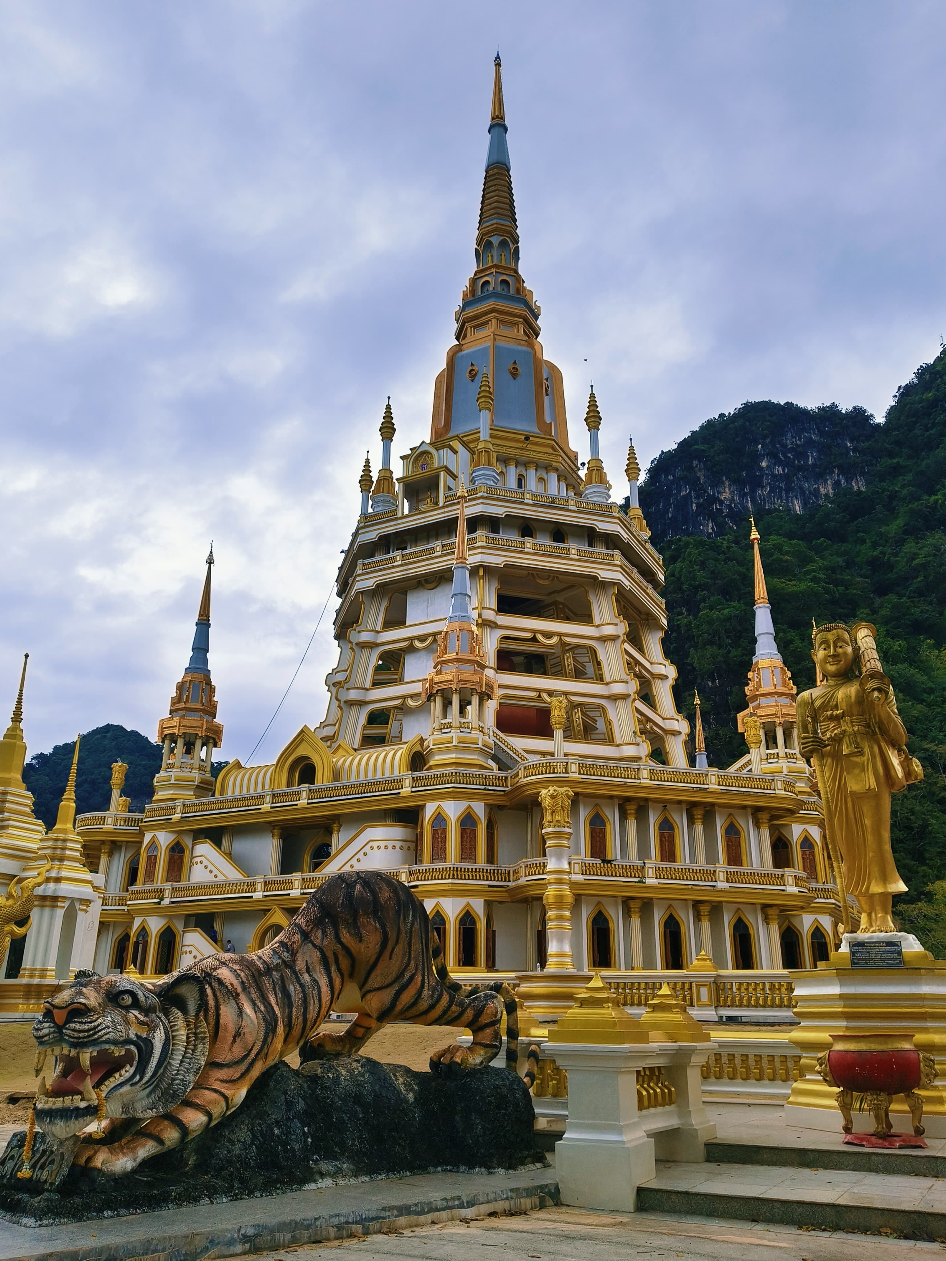 yellow Labrador retriever biting yellow tulip flower