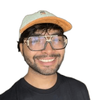 woman in blue denim jacket and white skirt standing beside brown wooden table
